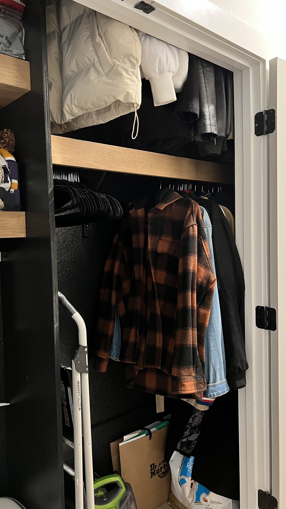 black-coat-closet-with-wood-shelves.jpg