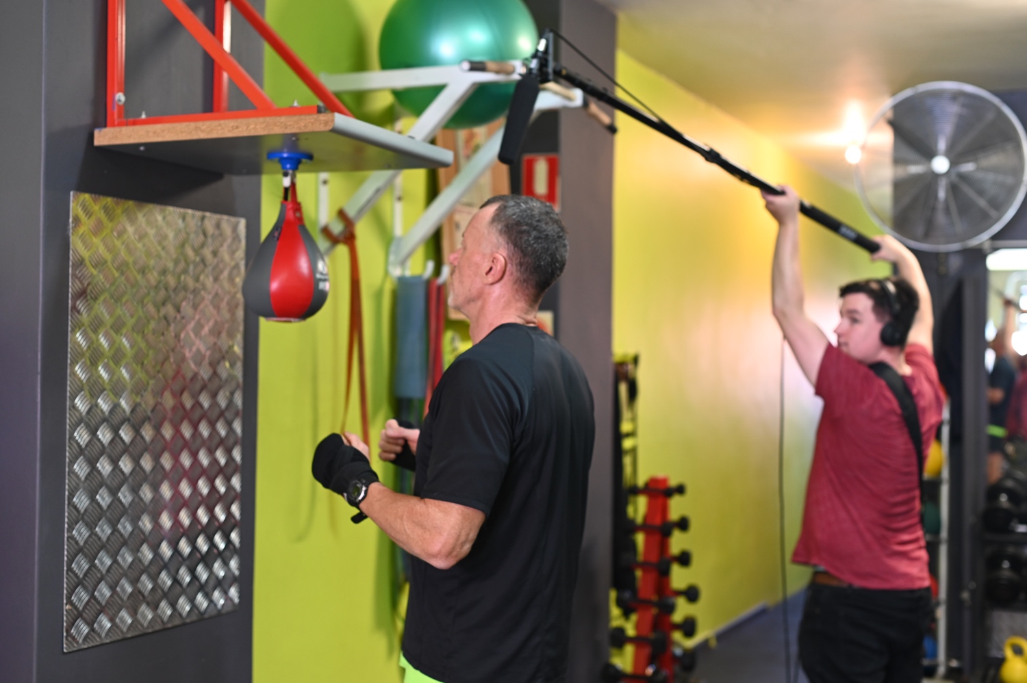 Michael recording the audio of Mark punching the speedball.