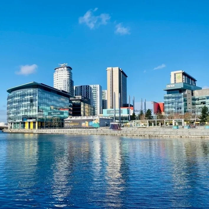 MediaCity, UK. Blue sky and blue water reflecting the buildings make this photo look fab.