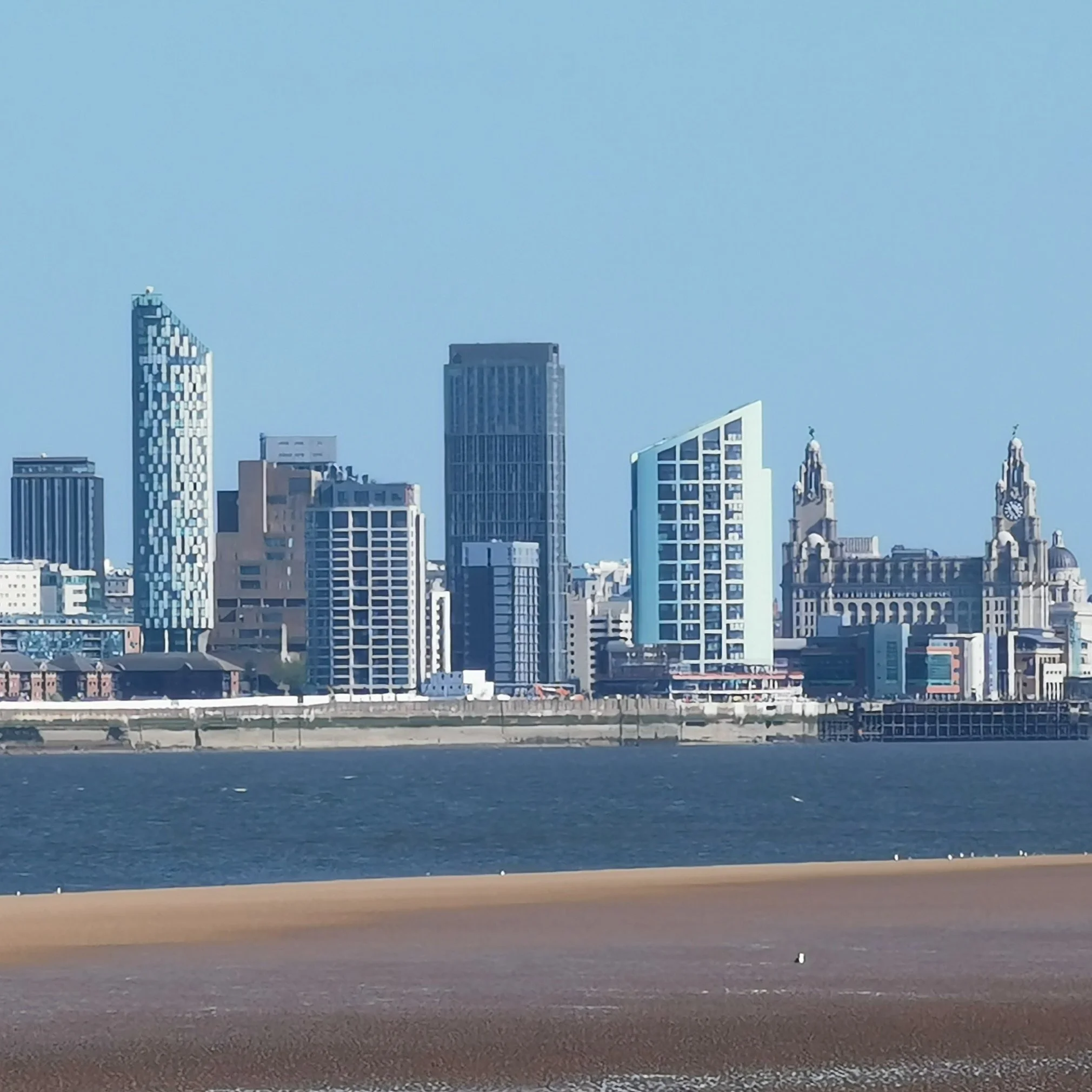 Photo taken from New Brighton of Liverpool skyline. You can see the Liver Birds on the right.