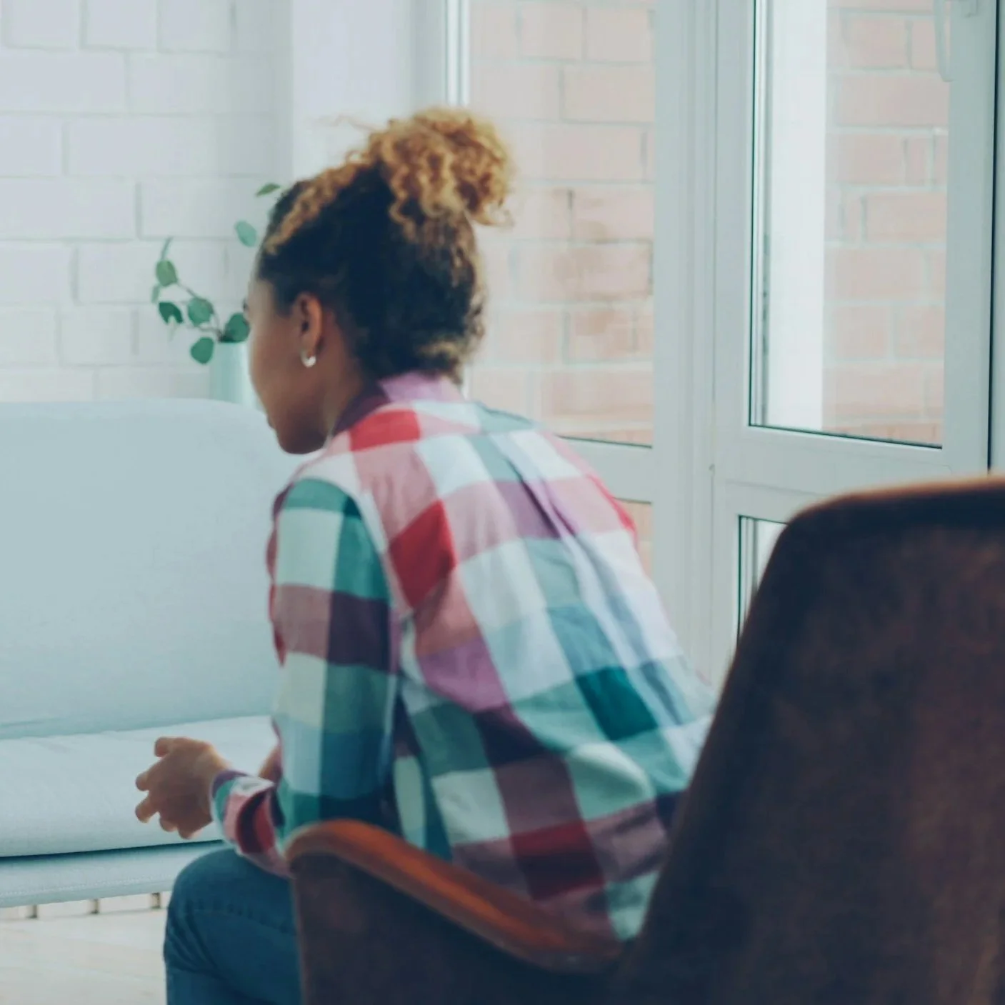 bipoc psychologist in armchair