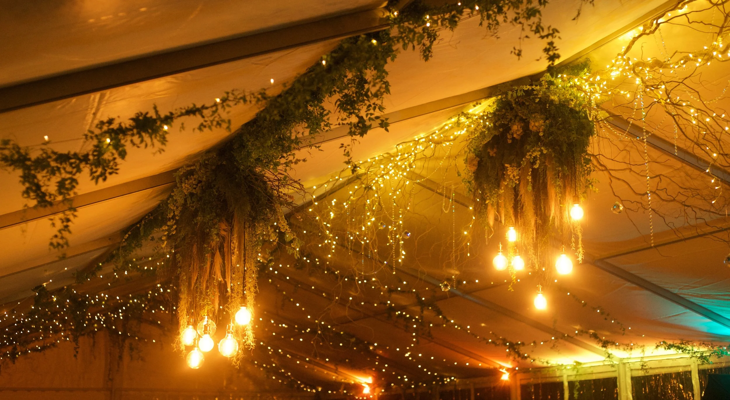 chandelier hanging from a tent wedding decorations