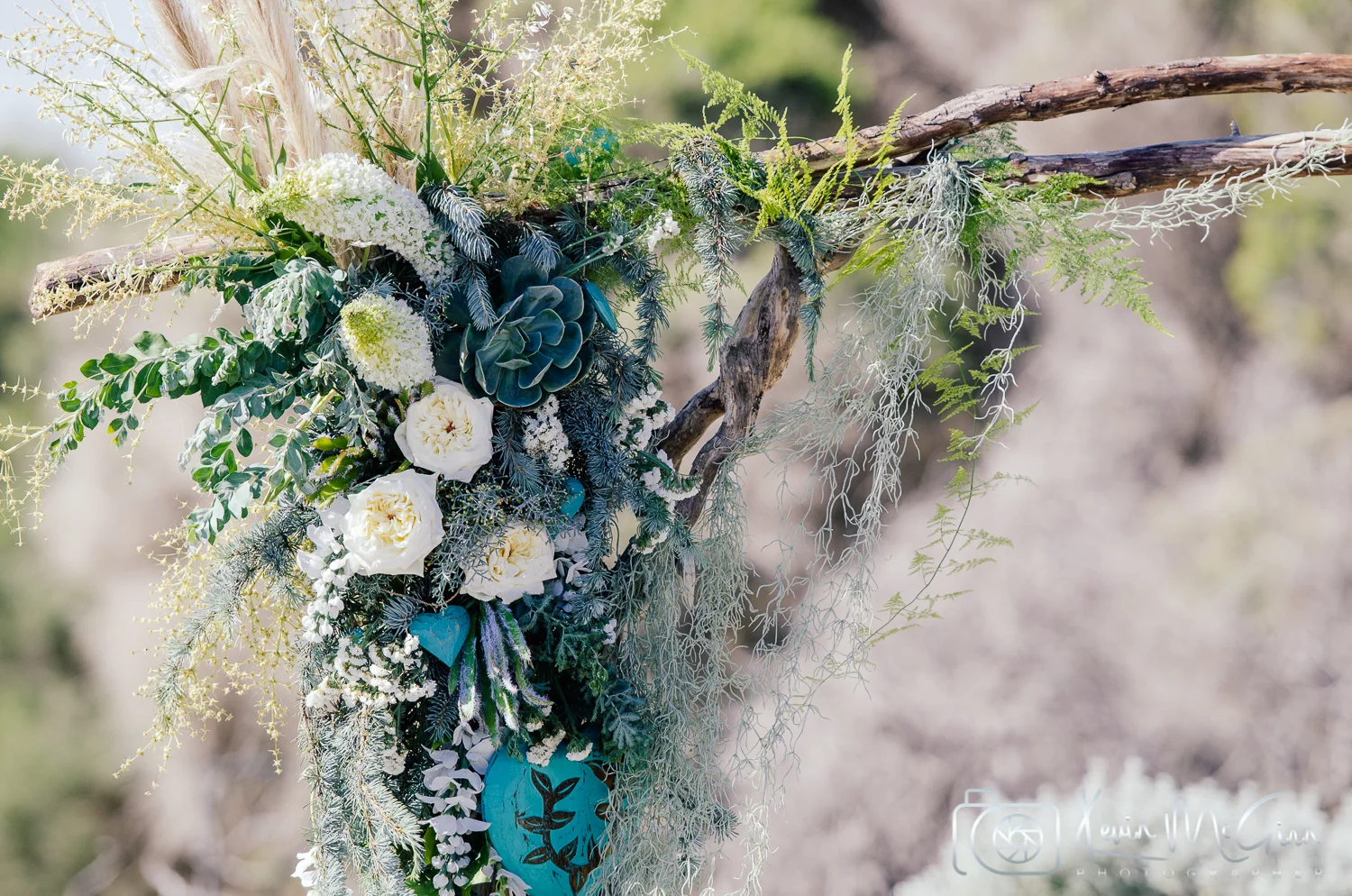 beautiful wedding flowers hanging from a twig