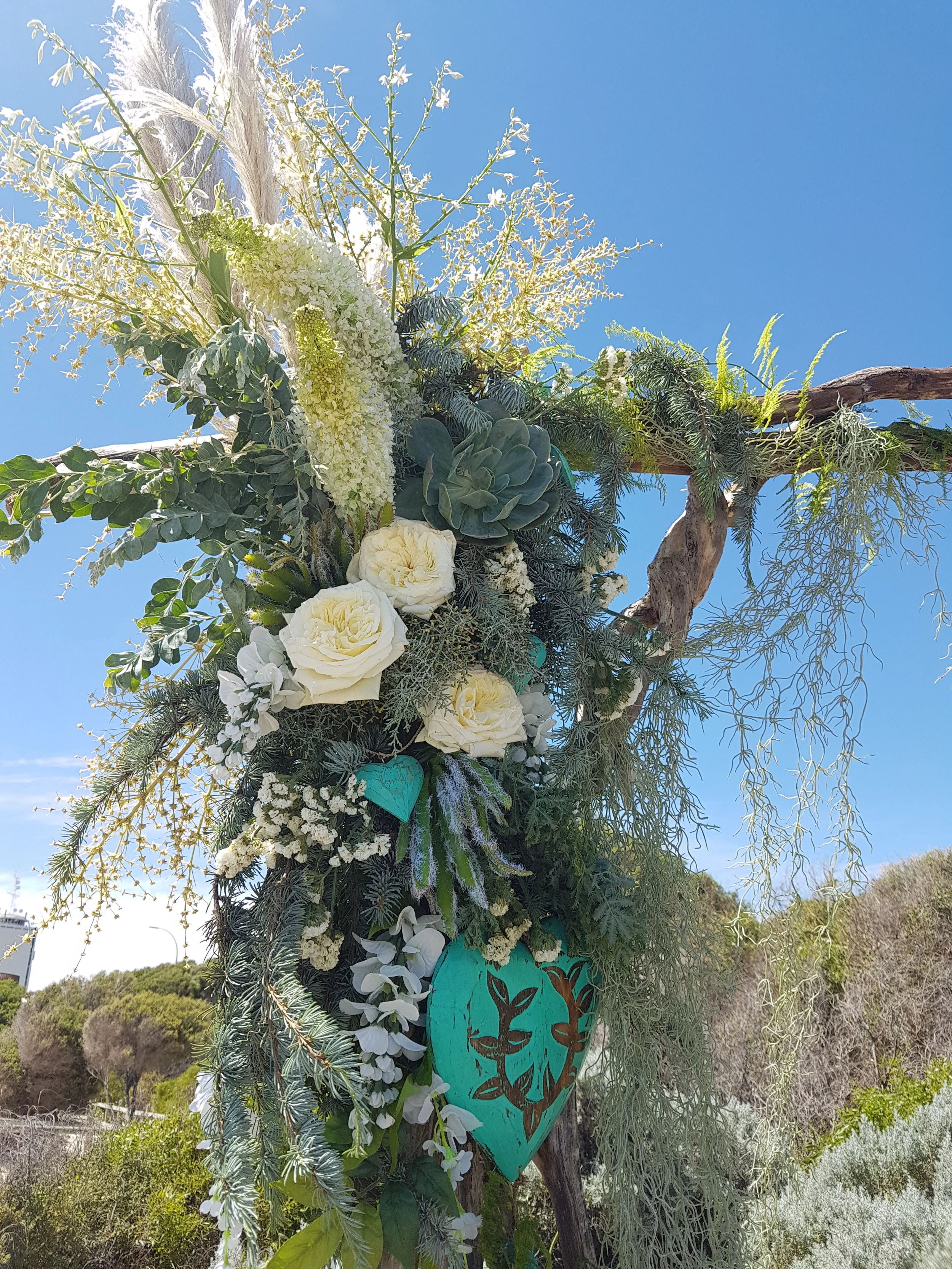 white and purple flower bouquet for wedding natural altar in the wild with plant decorations