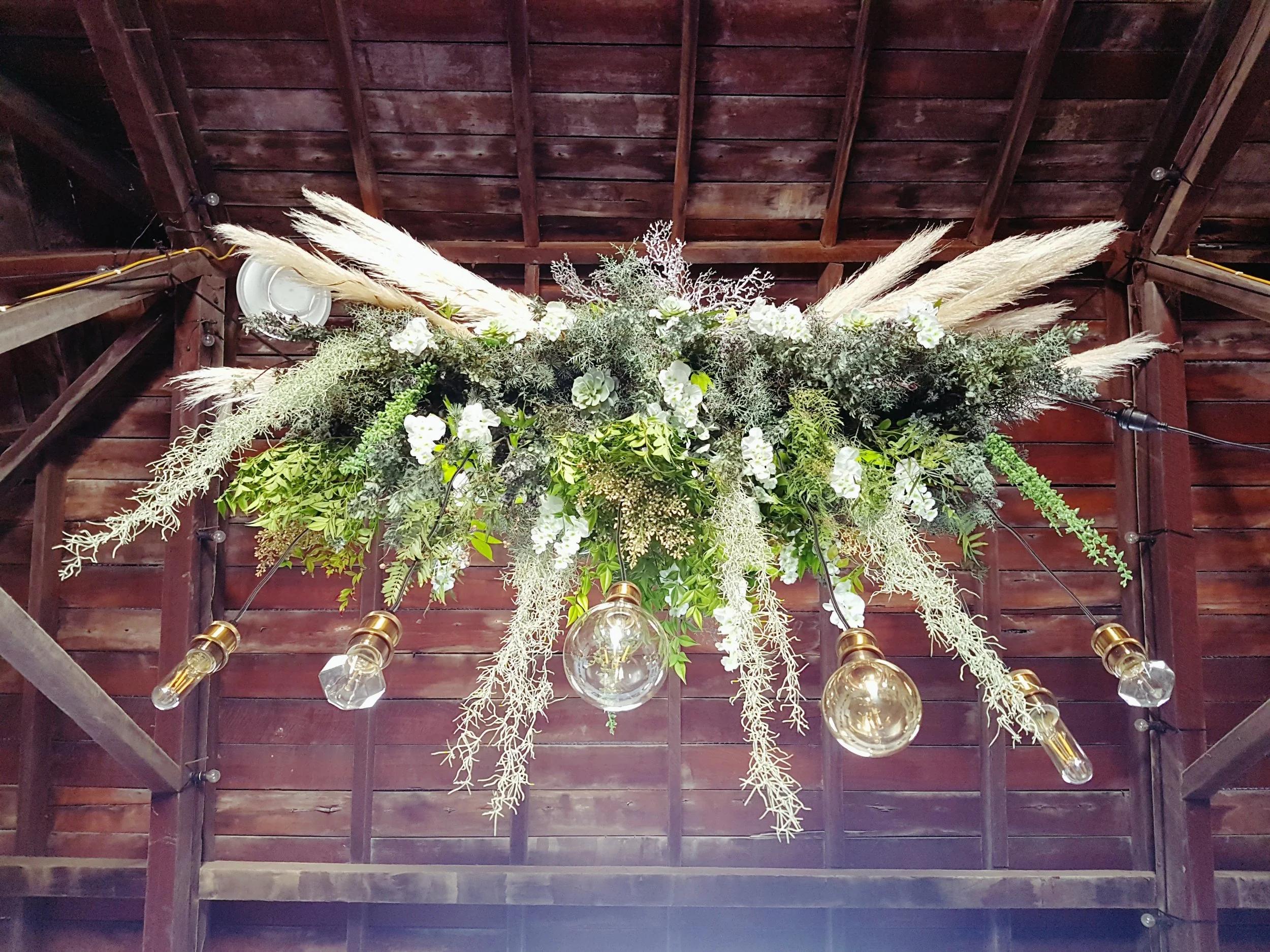 flower decorations hanging from a ceiling