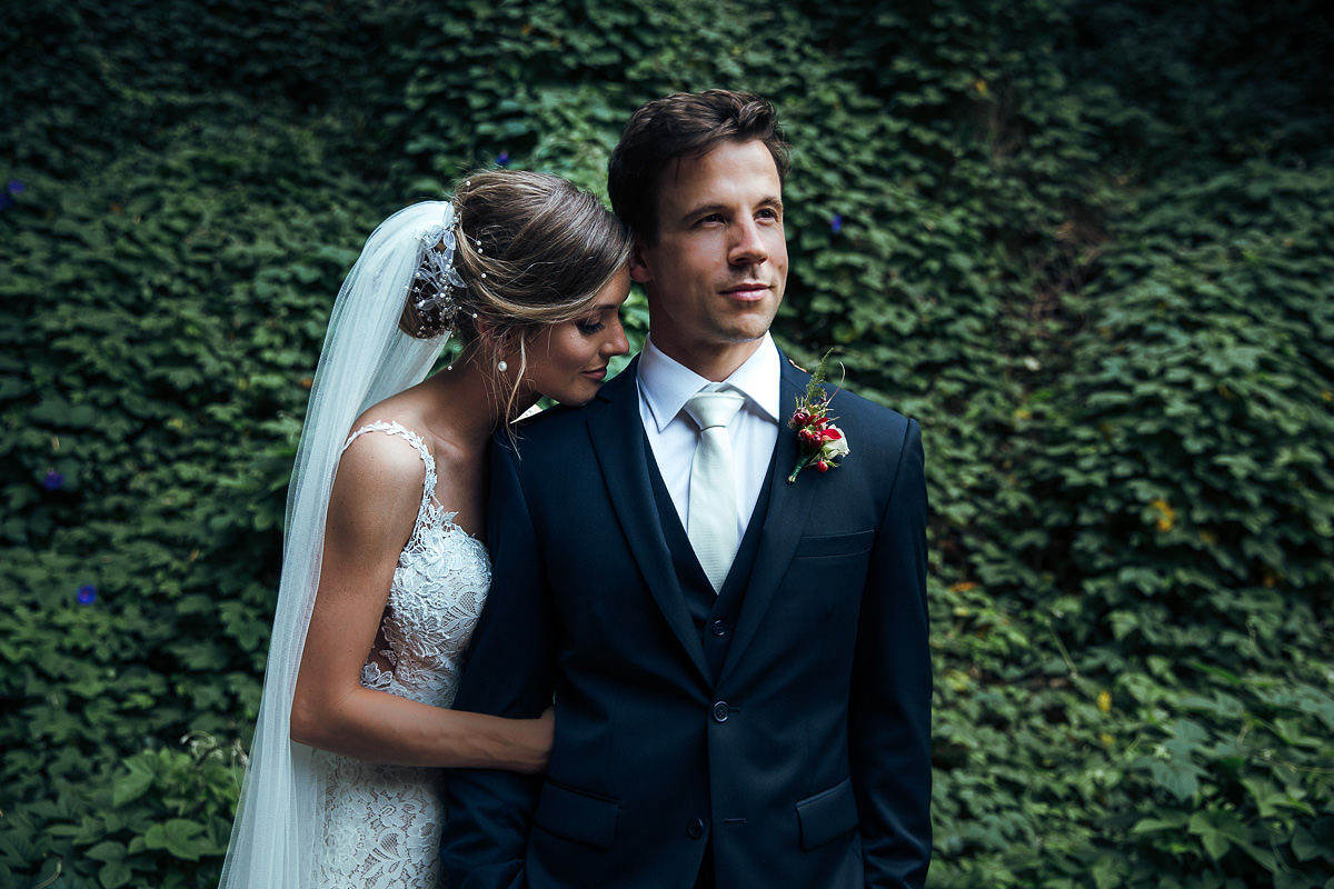 bride and groom holding each other romantic photo
