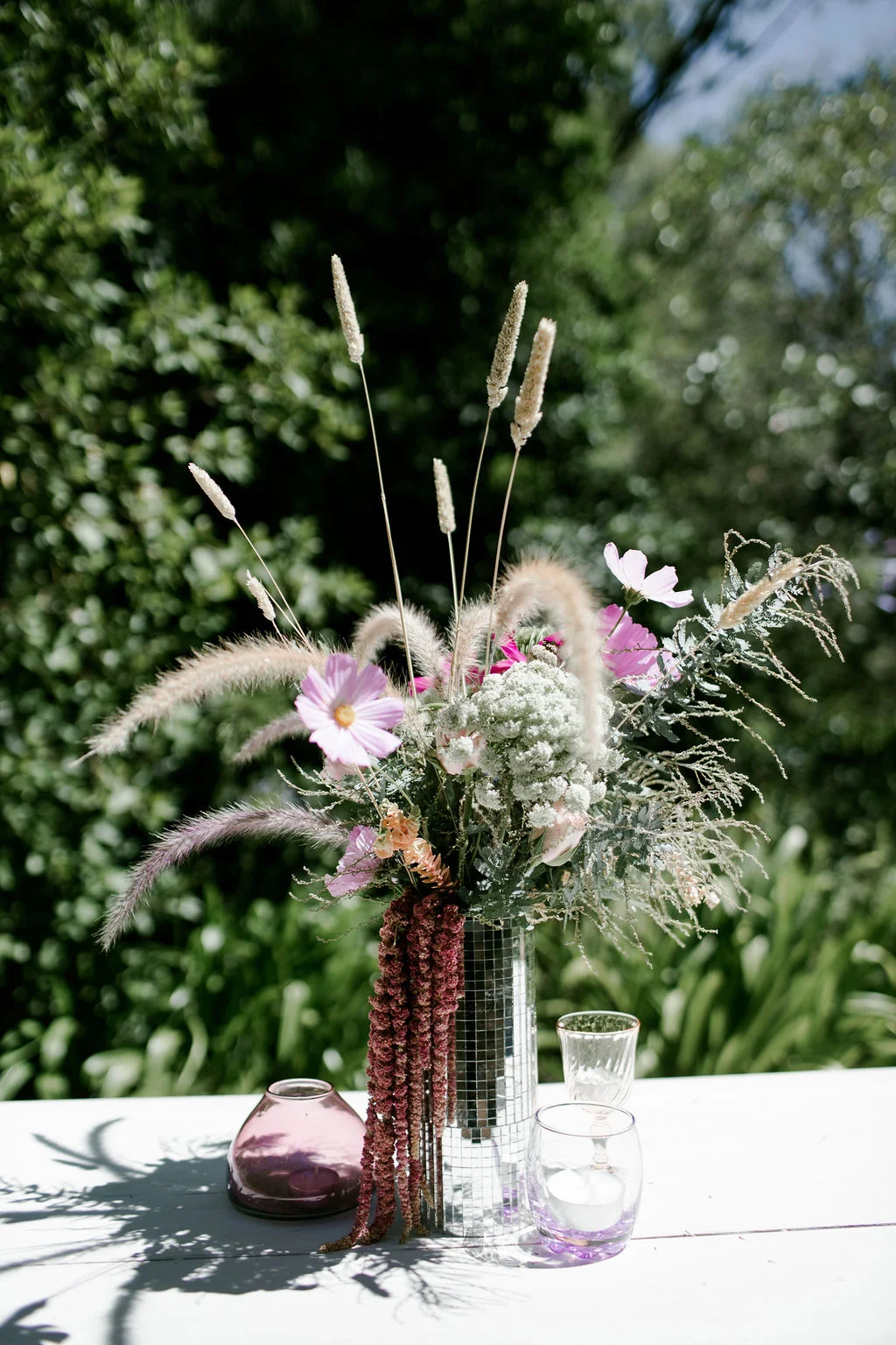 decorative flowers in a cylindrical vase