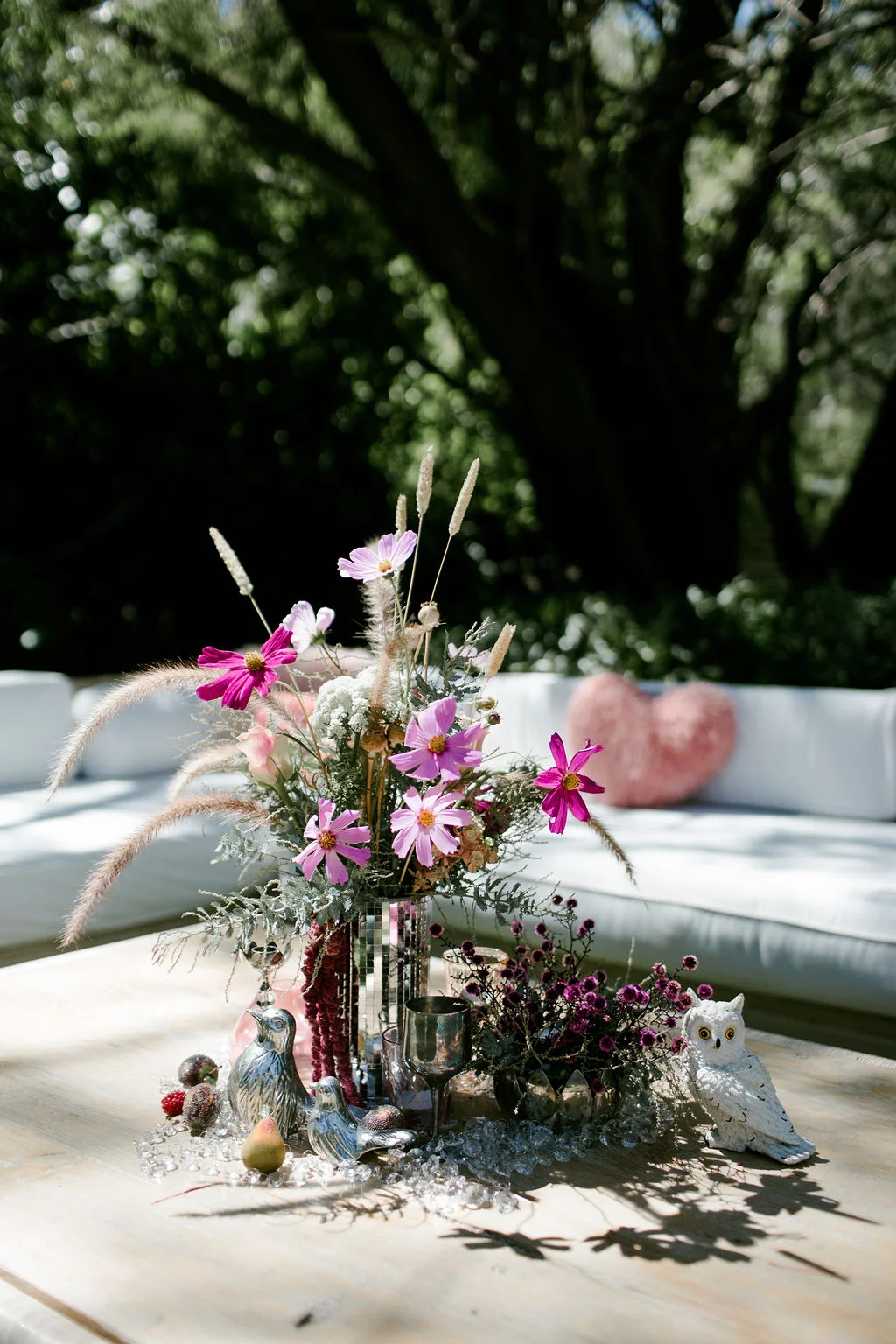 long white couch love pillows decorative flowers on the table