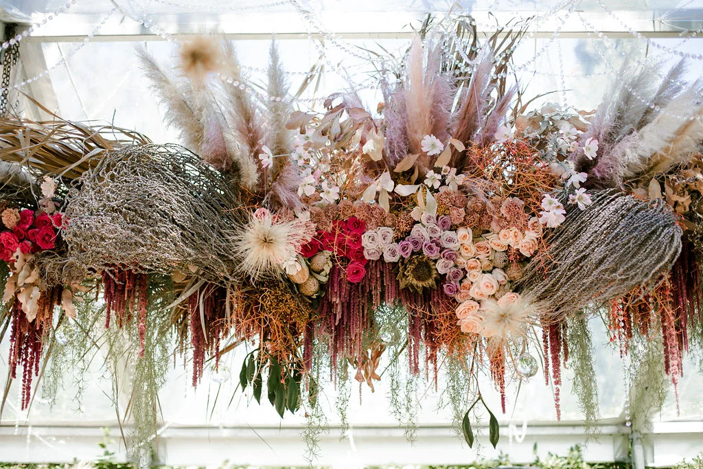decorative flowers assorted many colors hanged from a roof