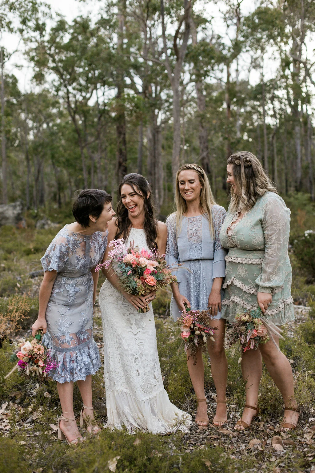 bride and brides maids walking bouquet of flowers