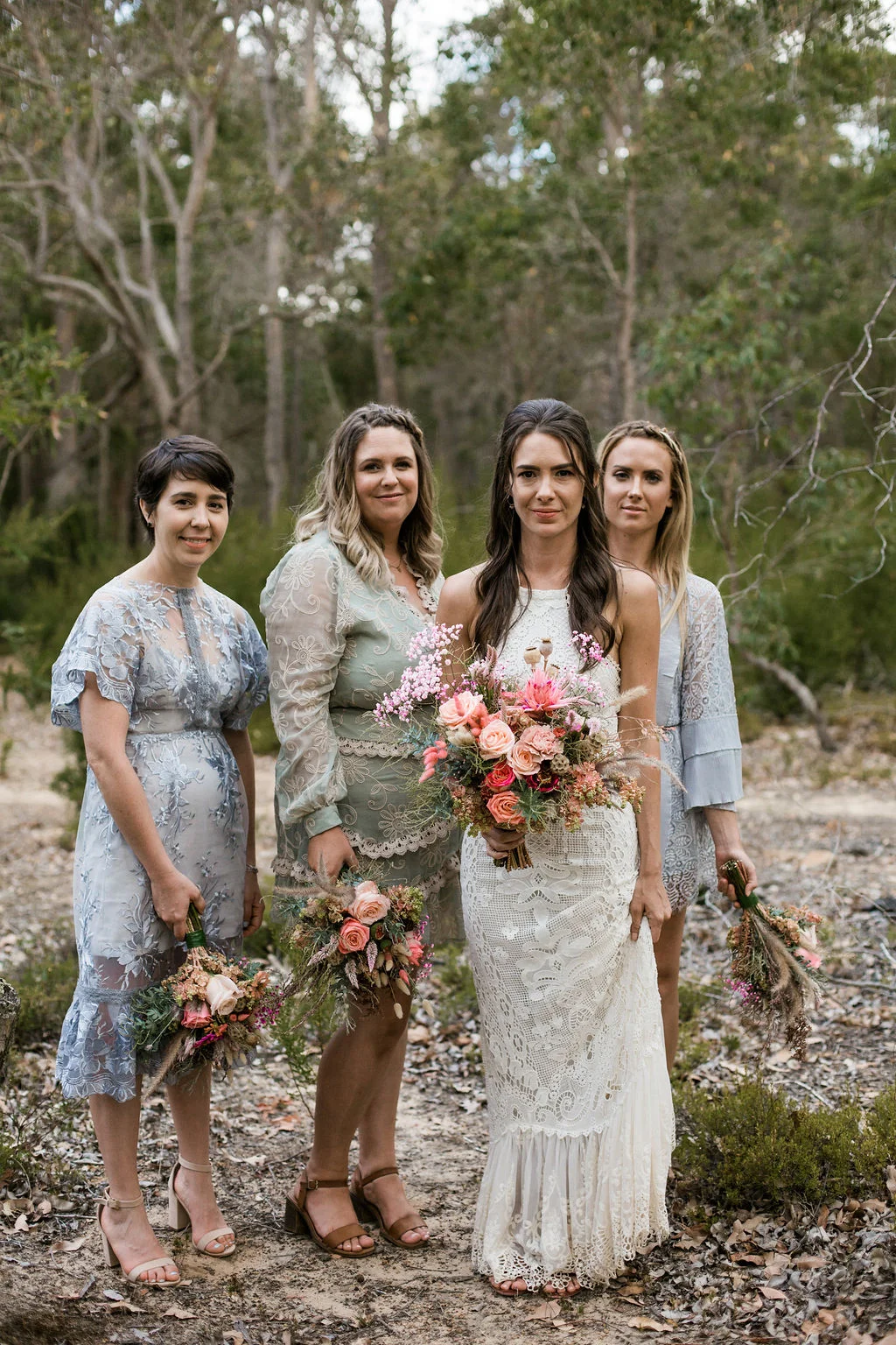 bride and brides maids walking bouquet of flowers