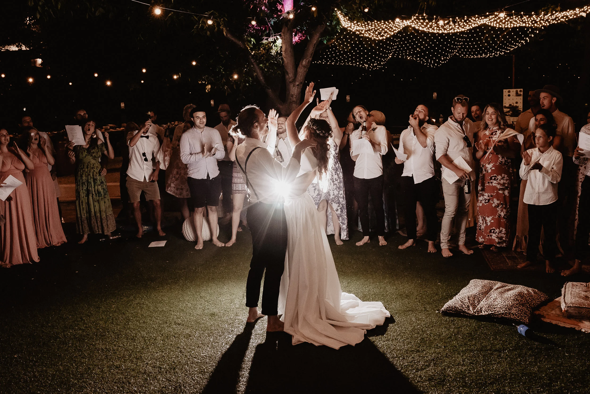 bride and bride groom holding hands dancing first dance