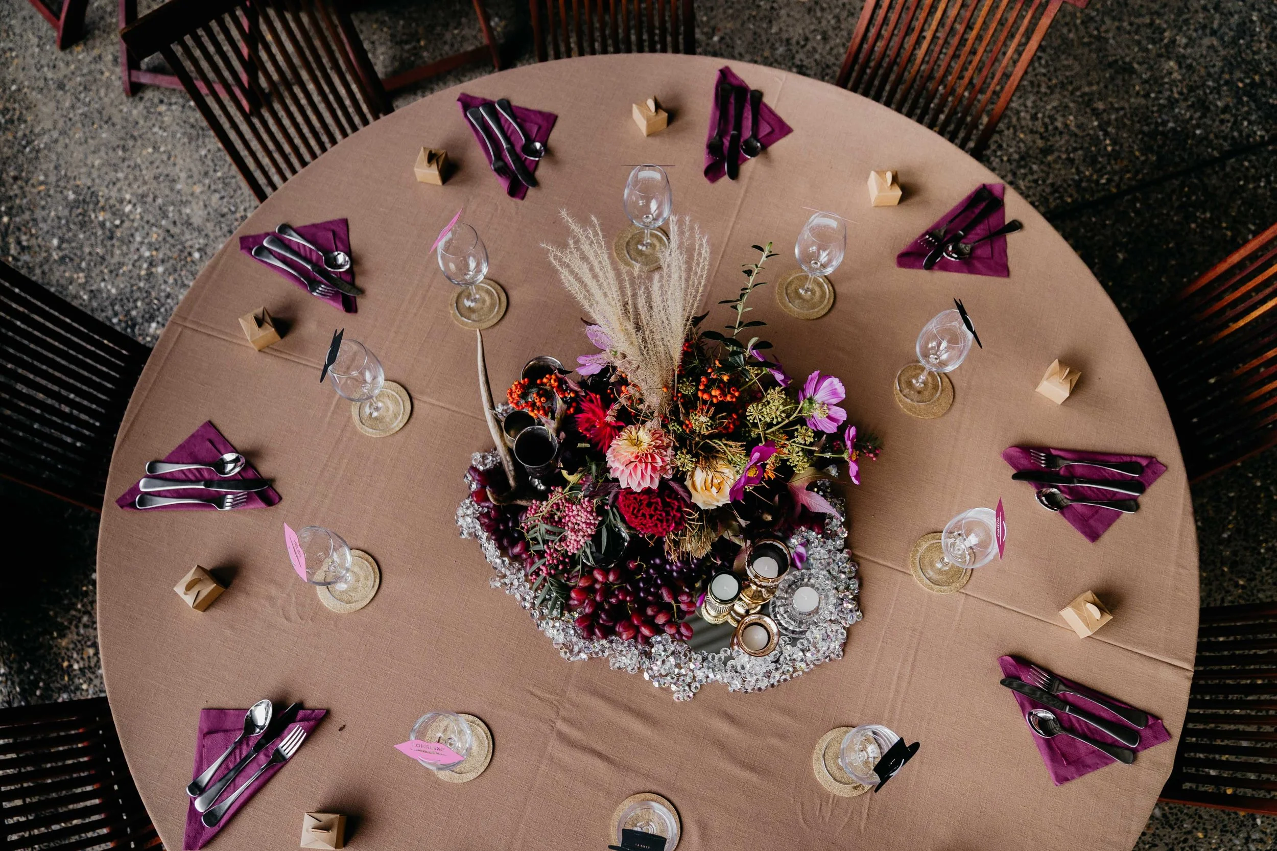 birds eye view of bridal table with gold linen and burgandy napkins