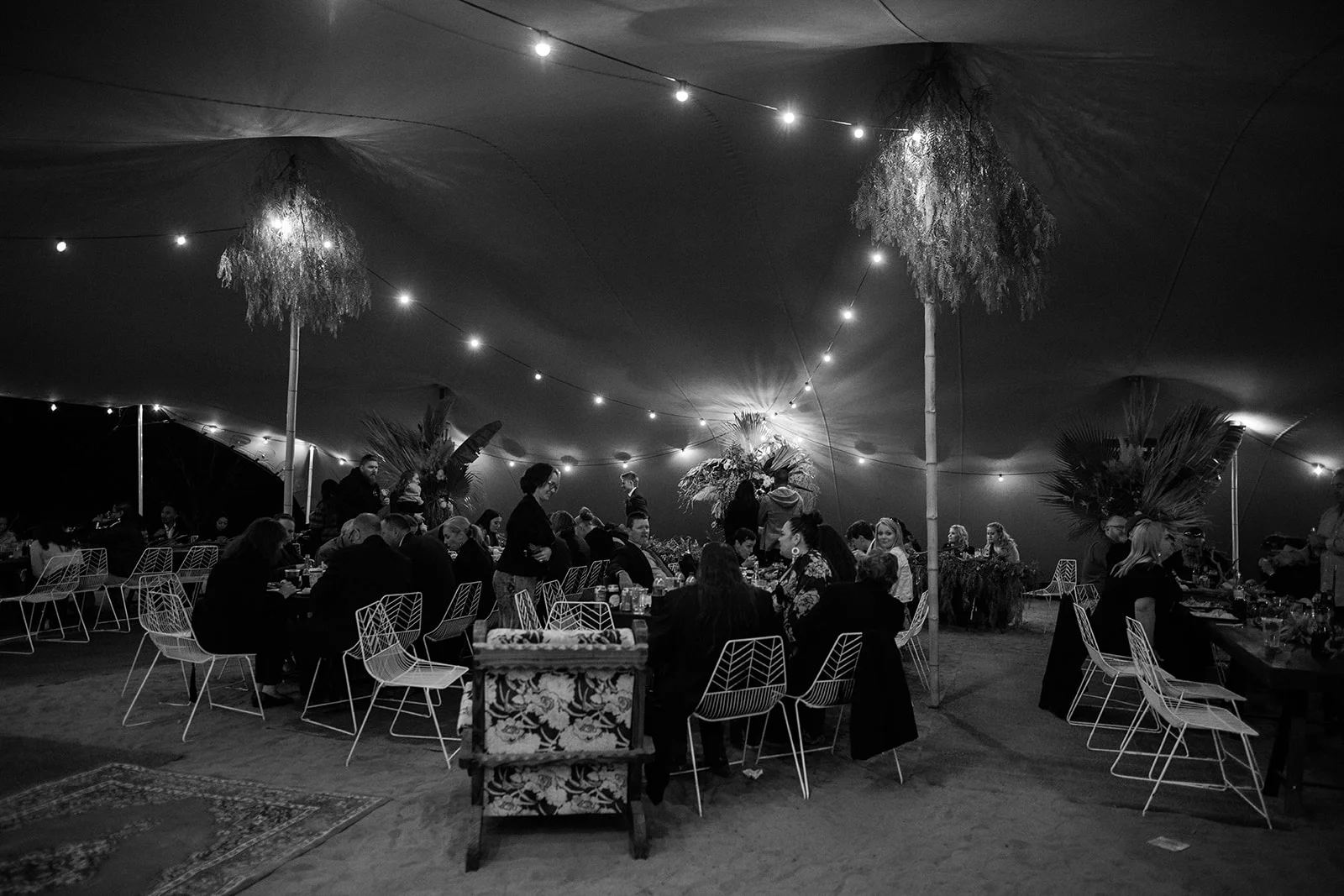 wedding reception at night guests seated and with full lighting