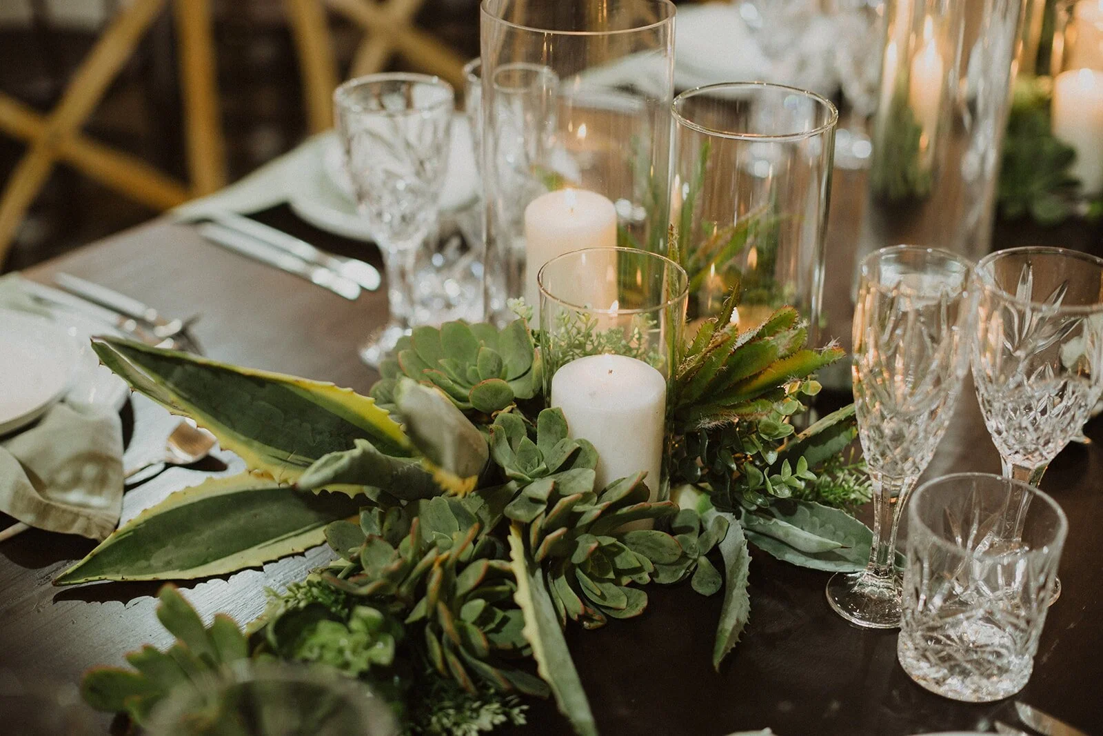 succulents with candles on wedding table
