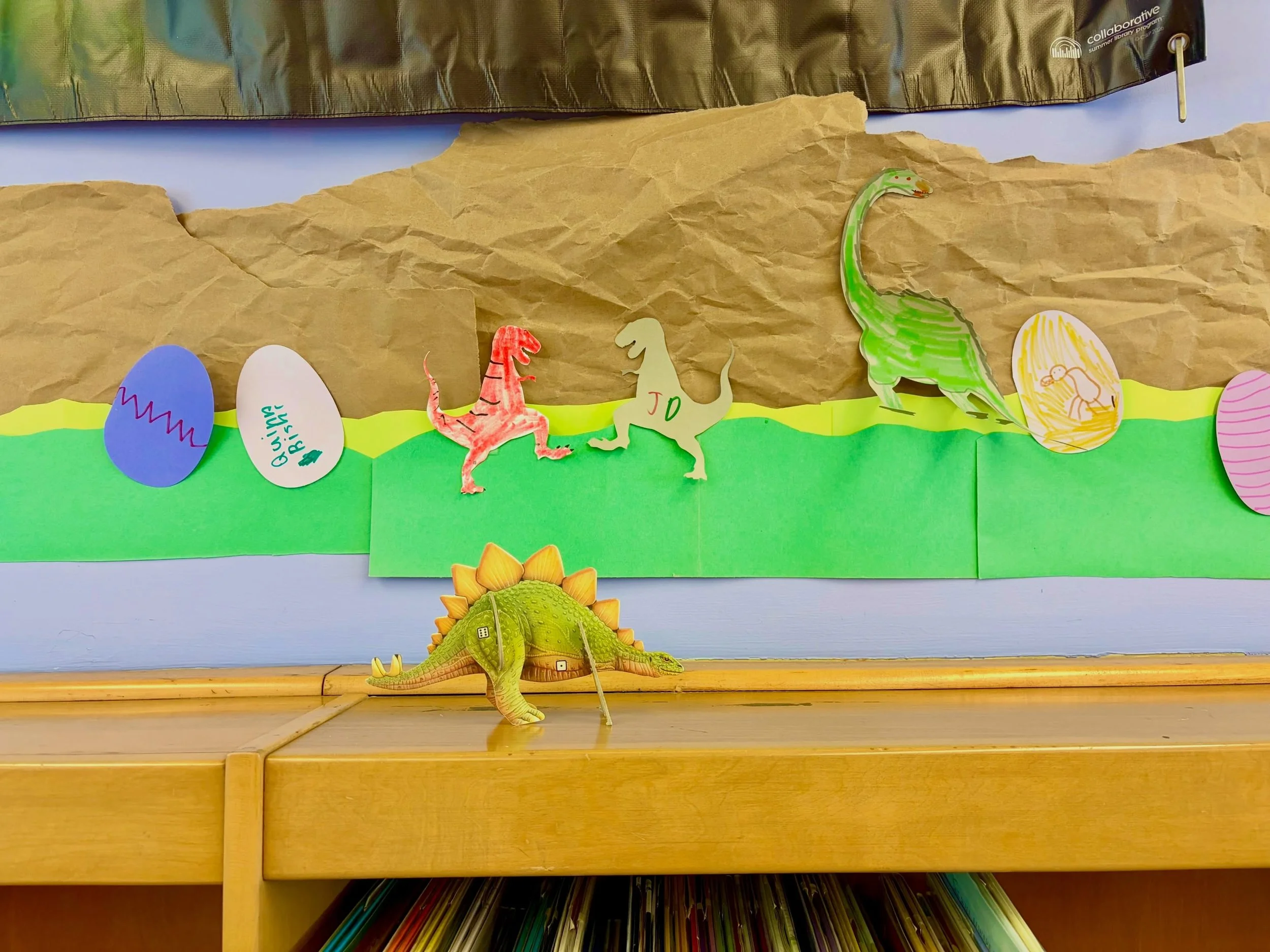Visit our Hilton Branch Library and design your own art piece as part of the Summer Reading Program! For every 2 hours of reading kids log, they can pick out a wall piece to color and add it to our sustainably made display. Unearth a story by colorin