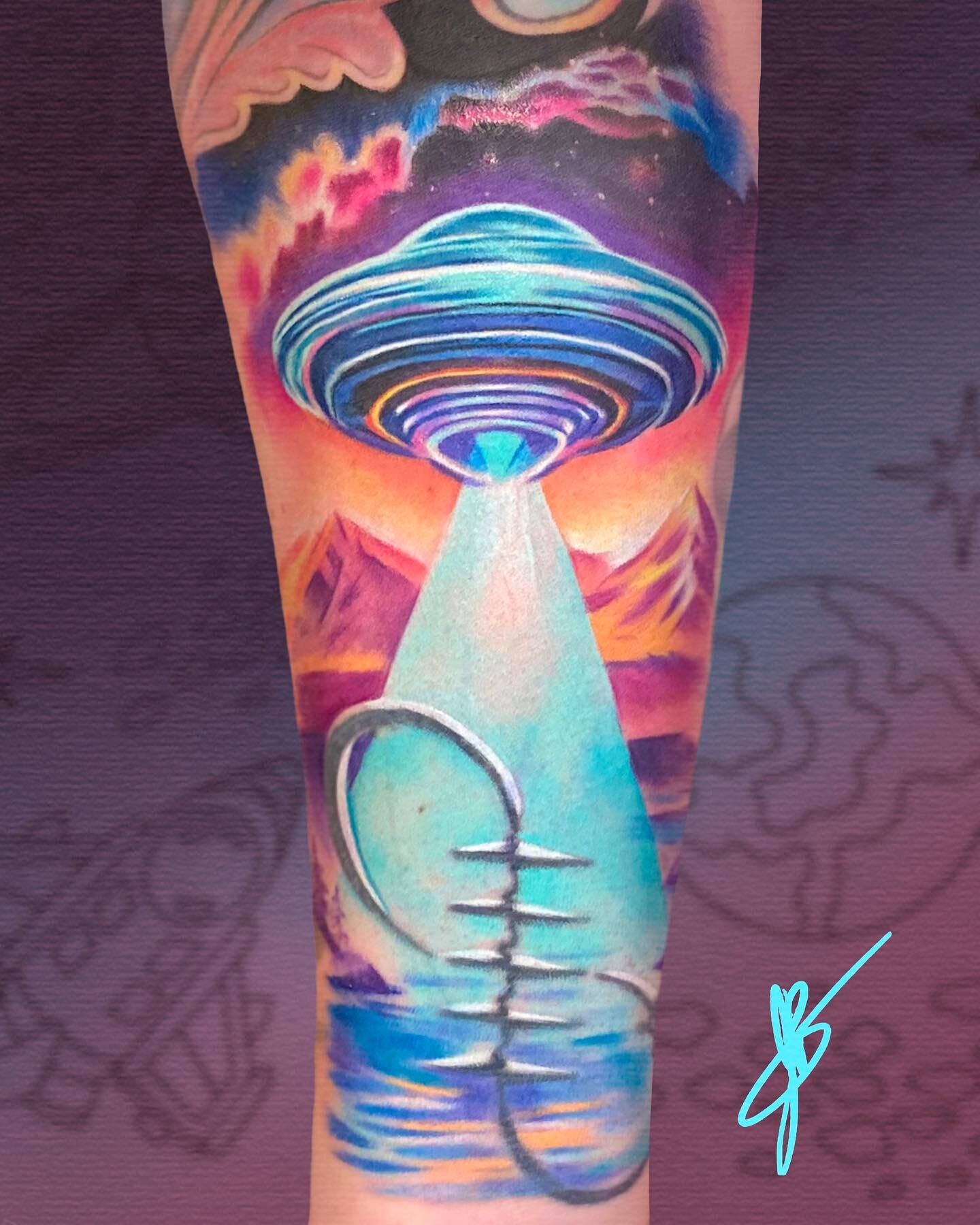 The heartbeat / infinity symbol was already on her wrist, but she wanted a ufo for her son, lovingly nicknamed &quot;Alien Overlord,&quot; so we reimagined it as a 3D object being beamed up by the ship. I love the neon color palette.