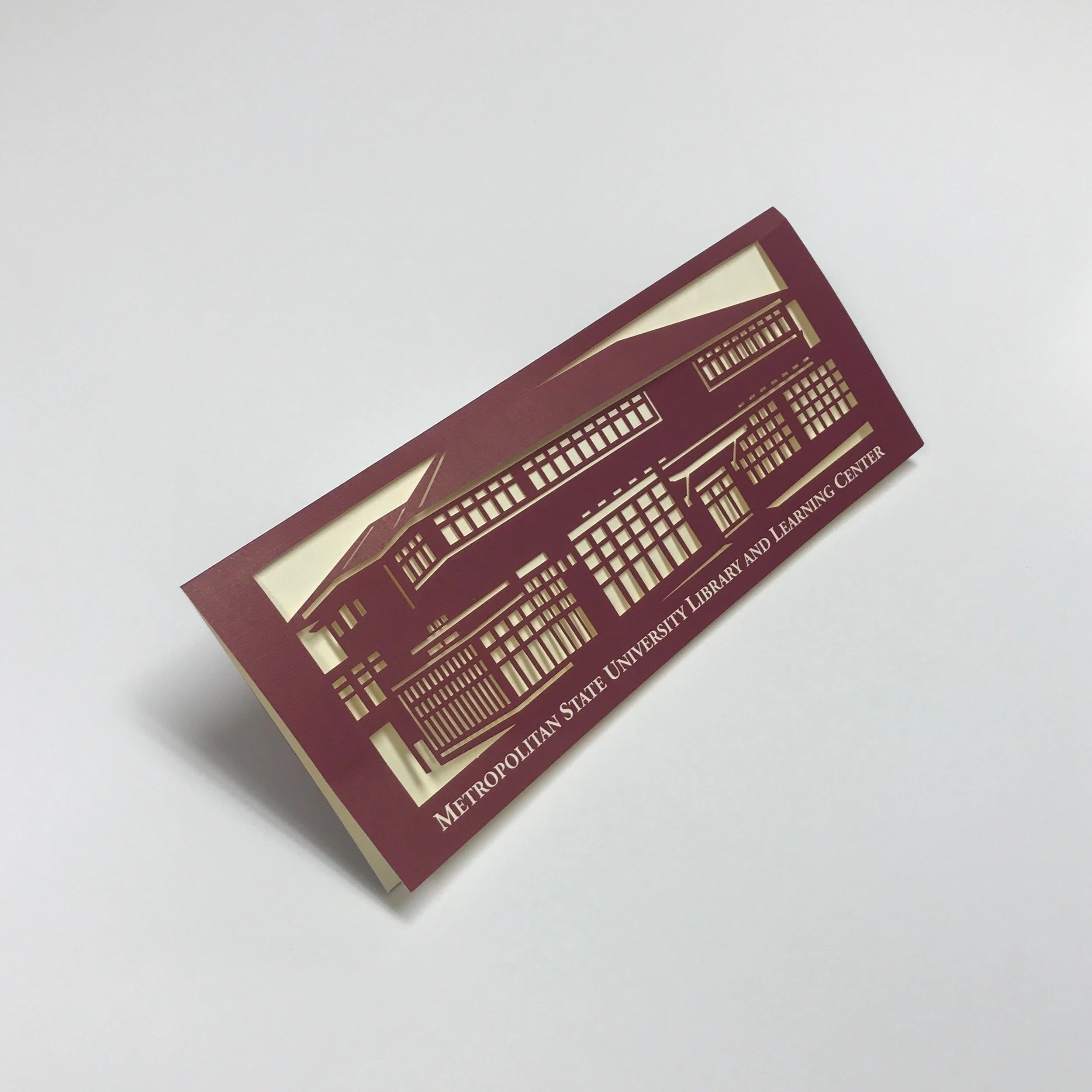 High quality die cutting on a higher education invitation printed in Minneapolis by Anderberg Print