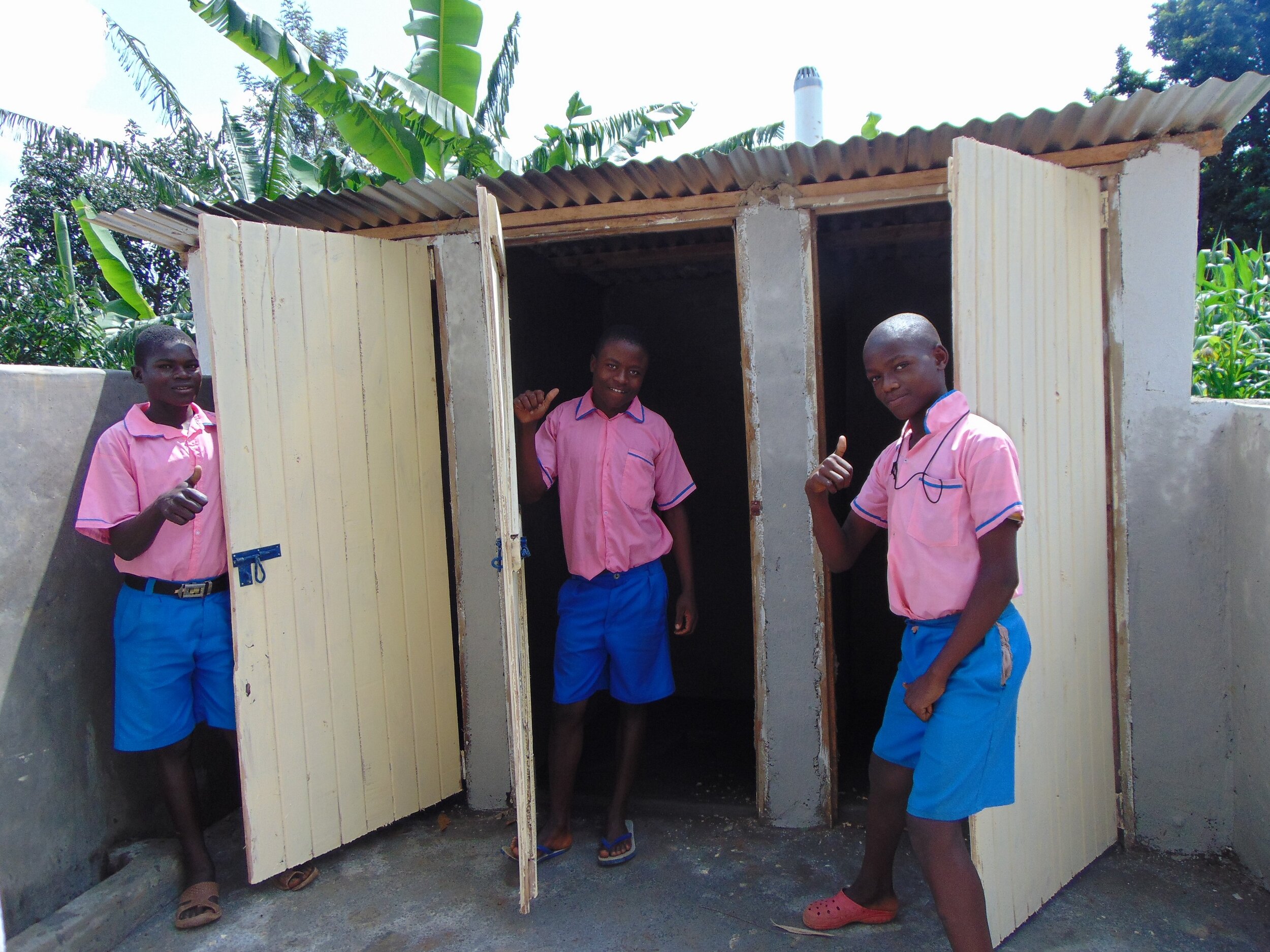21 kenya19046 Boys with their new latrines.JPG