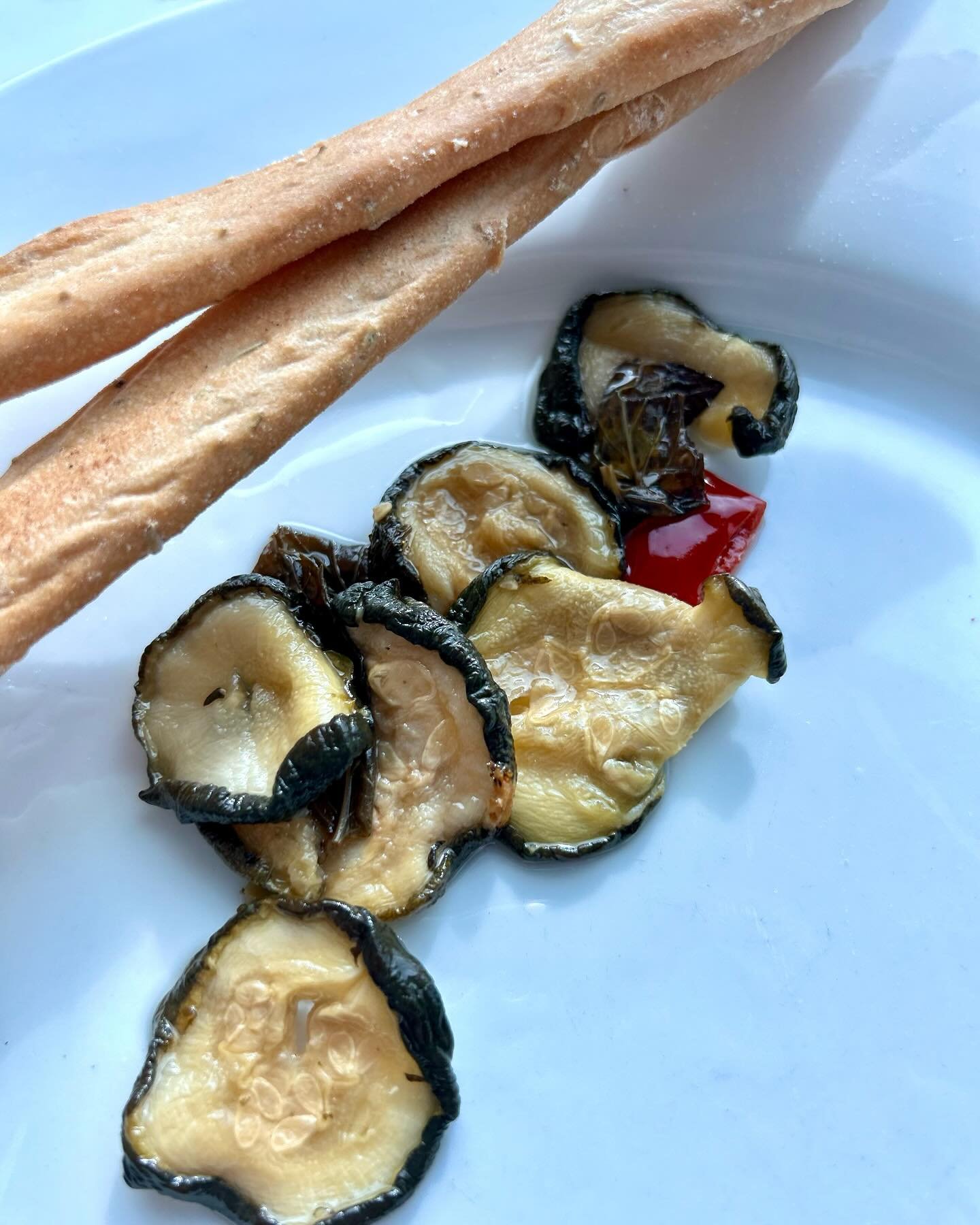 Southern Italian grown zucchini, sliced then salted and dried in the sunshine slowly&mdash;concentrating their flavor. Then preserved with extra virgin olive oil, capers, hot pepper, mint, garlic, lemon juice and apple cider vinegar. So good.🥖 🍷 

