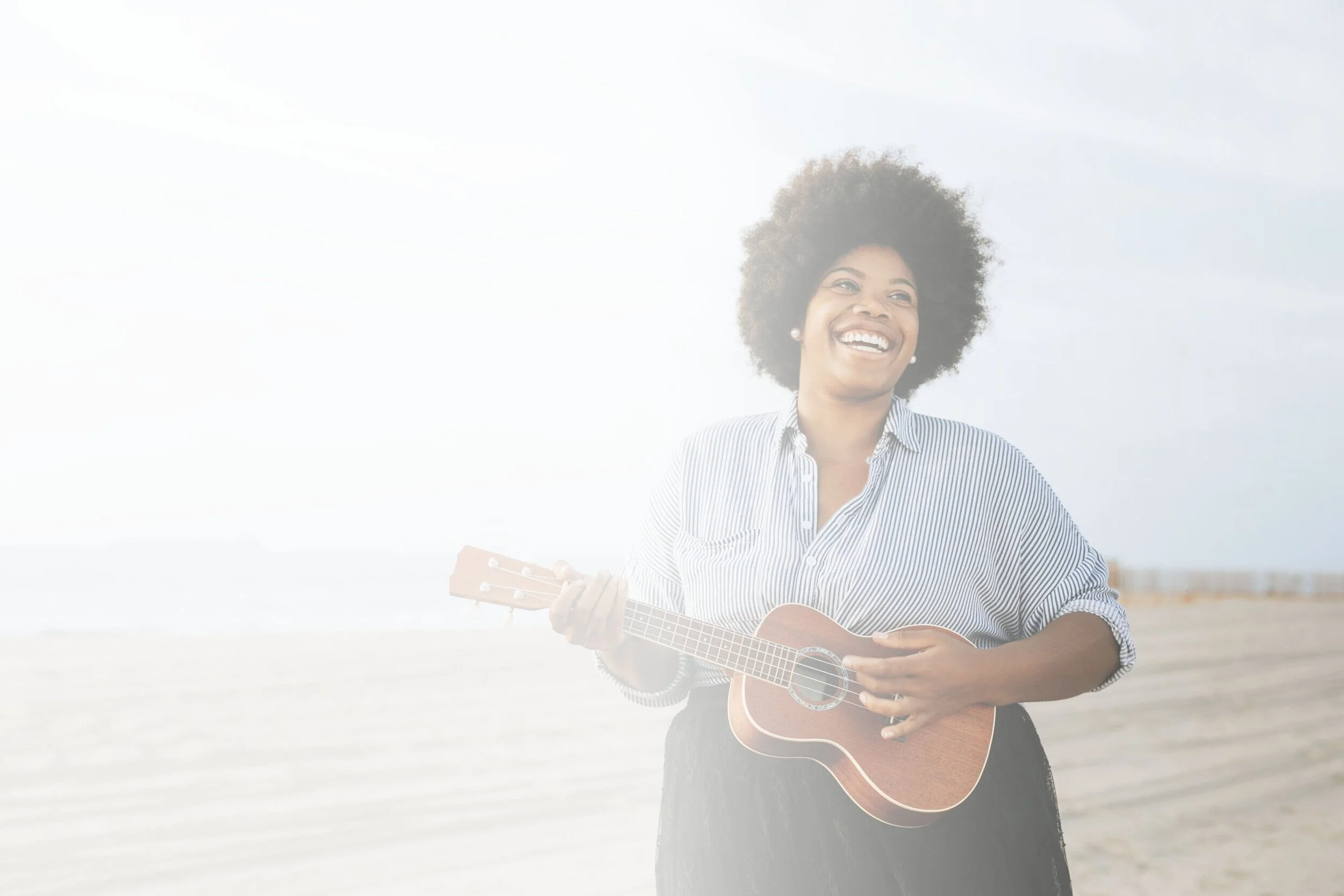 woman+playing+guitar-min.jpg