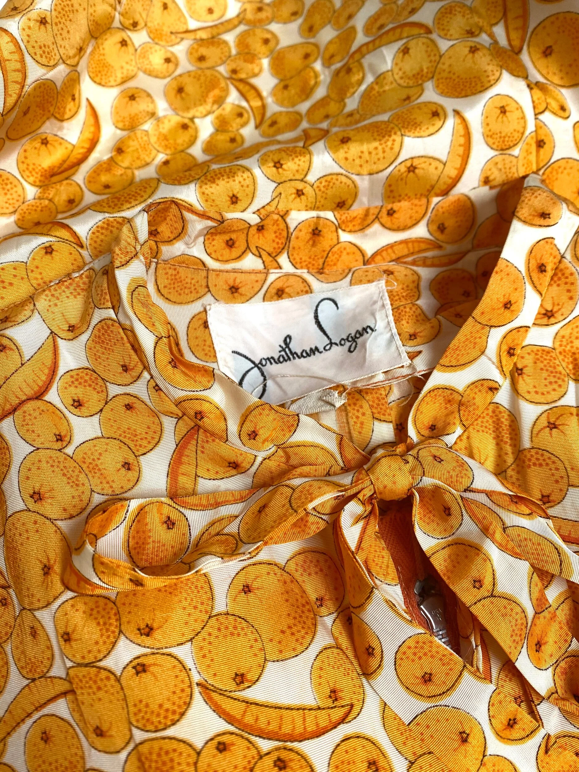 orange slice dress Introducing our stunning Orange Slice Maxi dress, crafted from high-quality  jute fabric for that perfect summer vibe. With its vibrant orange print and  side pleats pattern, this dress exudes elegance and flair