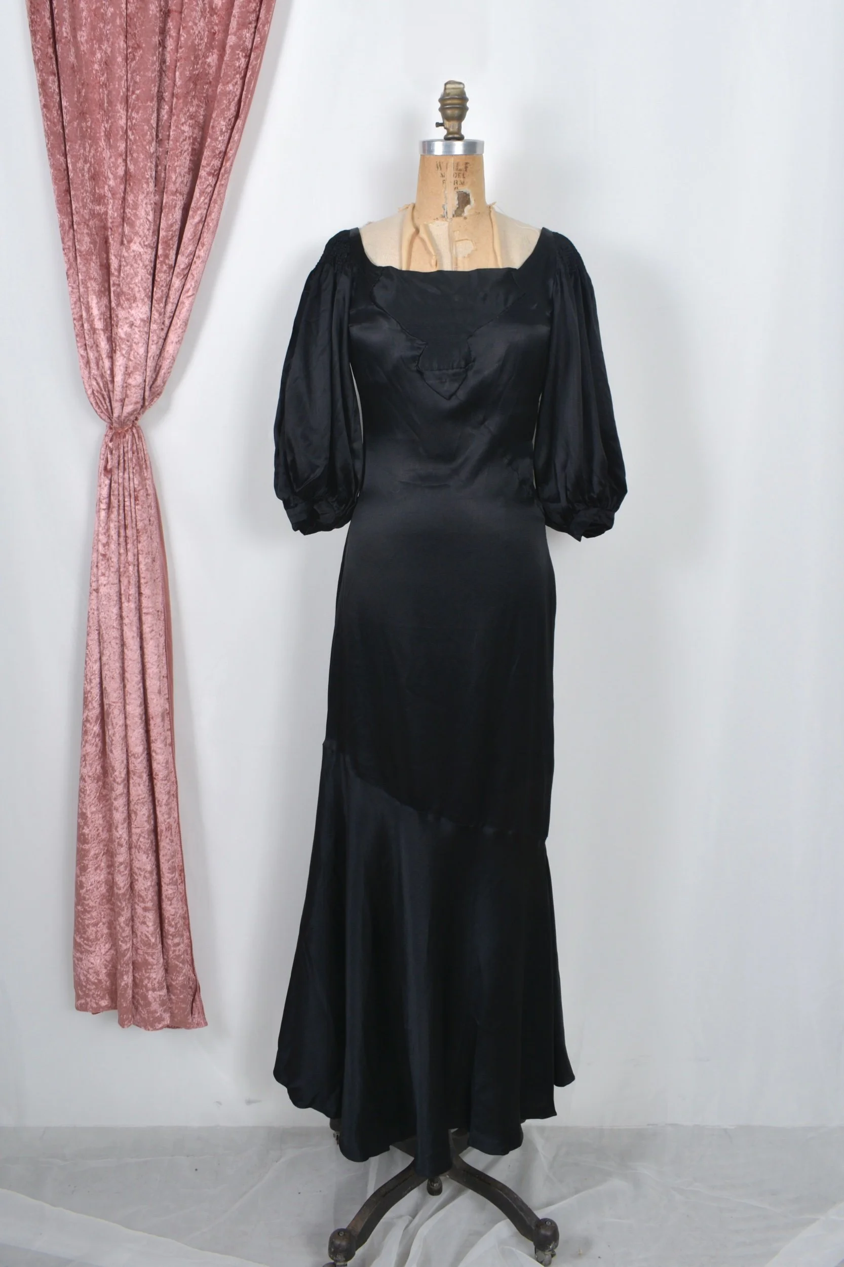 1930s black satin puff sleeve gown with cutout back