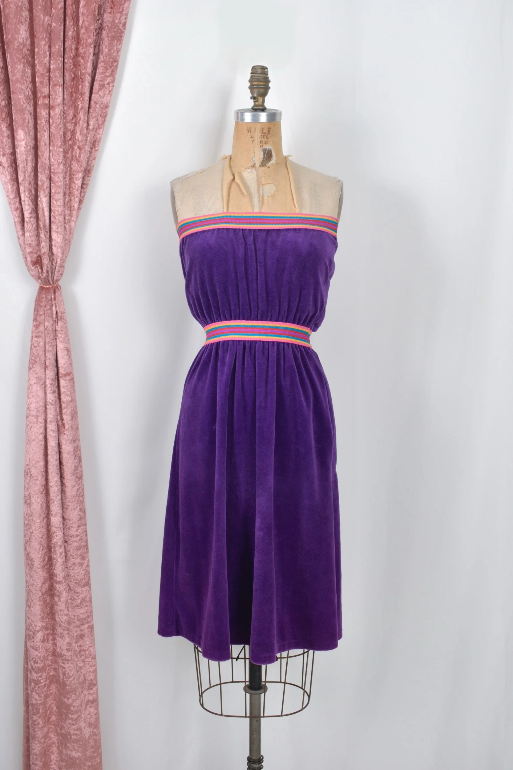 1970s purple strapless velour dress with rainbow trim