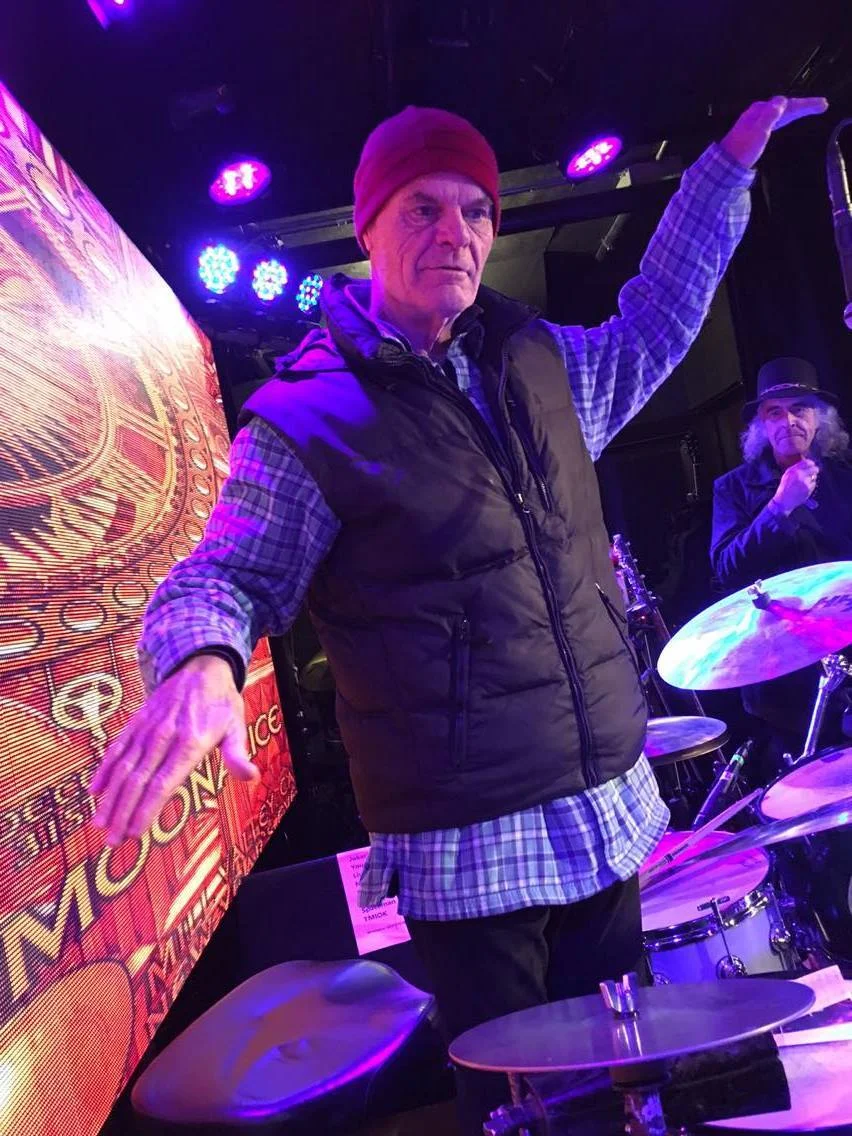 Drummer John Molo, the inspiration for an octopus character in Makoona, does his best impression of an 8-legged sea creature