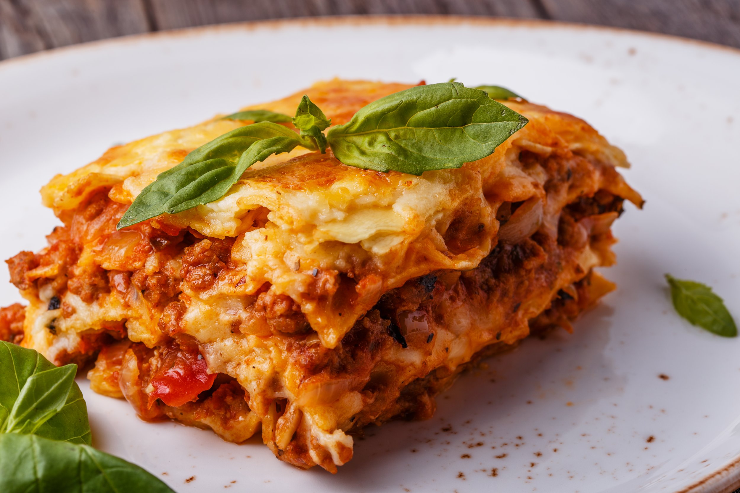 traditional-lasagna-made-with-minced-beef-bolognese-sauce-bechamel-sauce-topped-with-basil-leafs.jpg