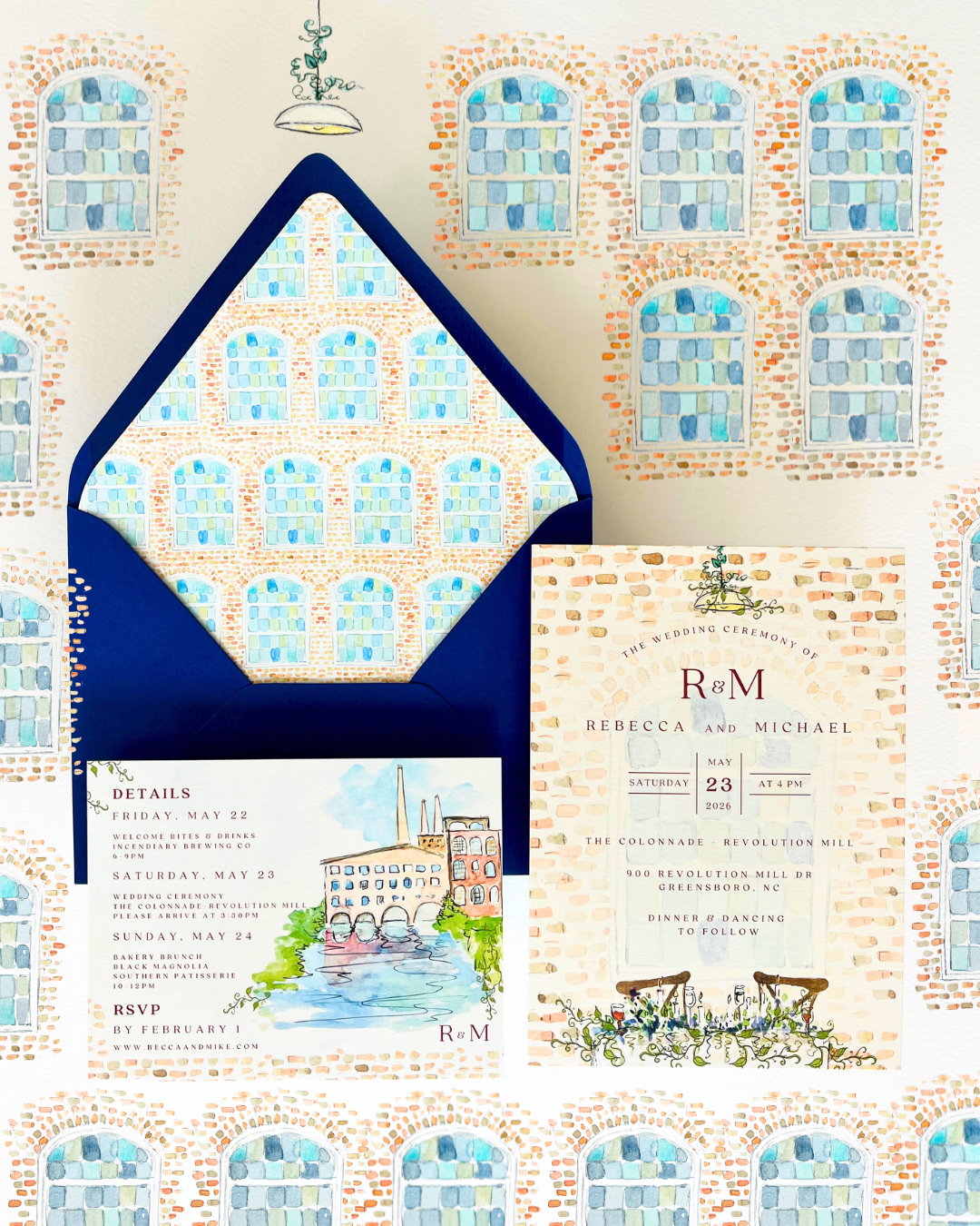 Invitation to a wedding with a brick building background pattern, featuring blue and white windows, and details of the wedding ceremony of Rebecca and Michael on Saturday, May 23, 2026, at 4 PM at the Revolution Mill in Greensboro, North Carolina.