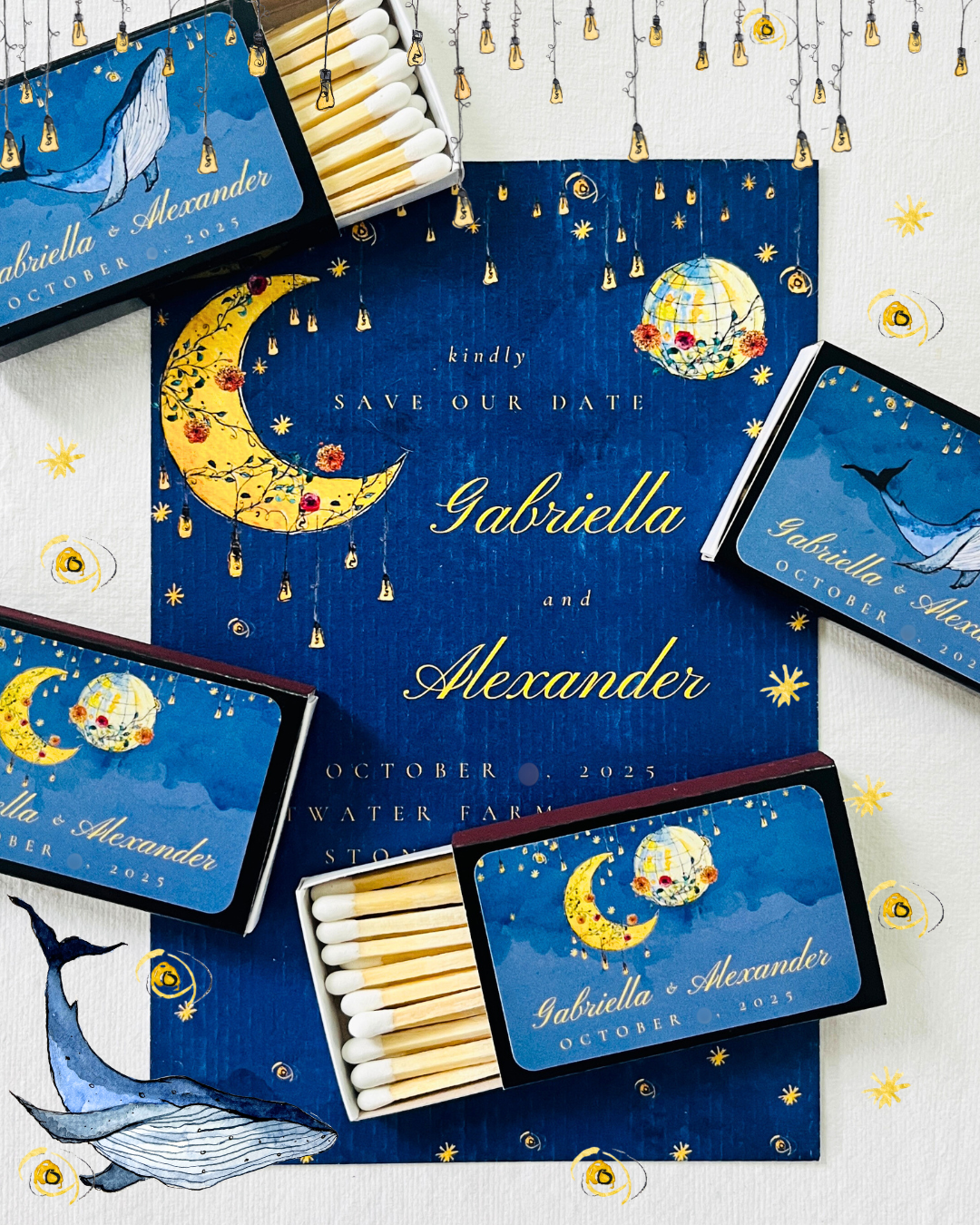 A set of personalized butterfly and whale-themed wedding save the date cards for Gabriella and Alexander's October 2025 wedding, decorated with illustrations of a moon, stars, a globe, and string lights, along with matchboxes that have matching desig