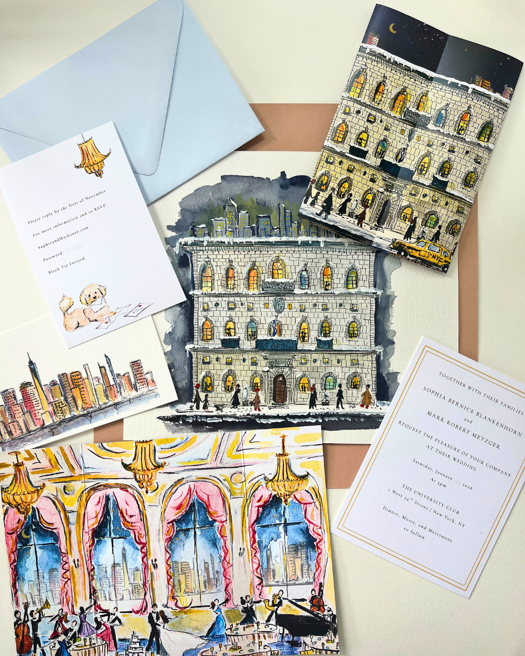 A collection of illustrated wedding invitations and cards with cityscape and theater interior scenes, all featuring sketches of New York City landmarks and night scenes, along with light blue and brown envelopes.