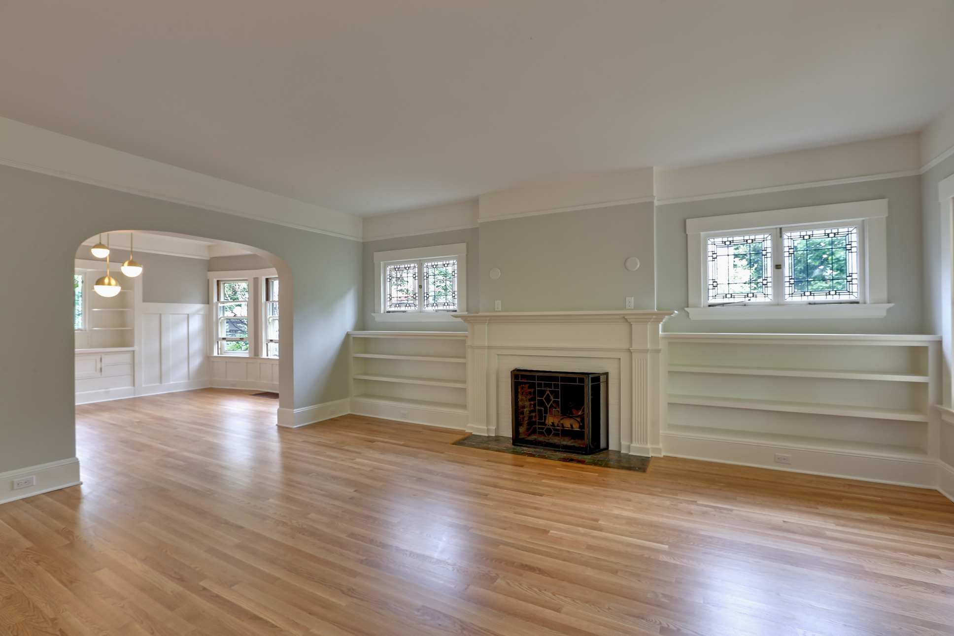  In this extensive, multifaceted project we renovated living room, dining room, kitchen, upstairs bath, and full basement for a cohesive, refreshed look throughout – click through to see it all! In the living room, new white oak floors, freshly skim-