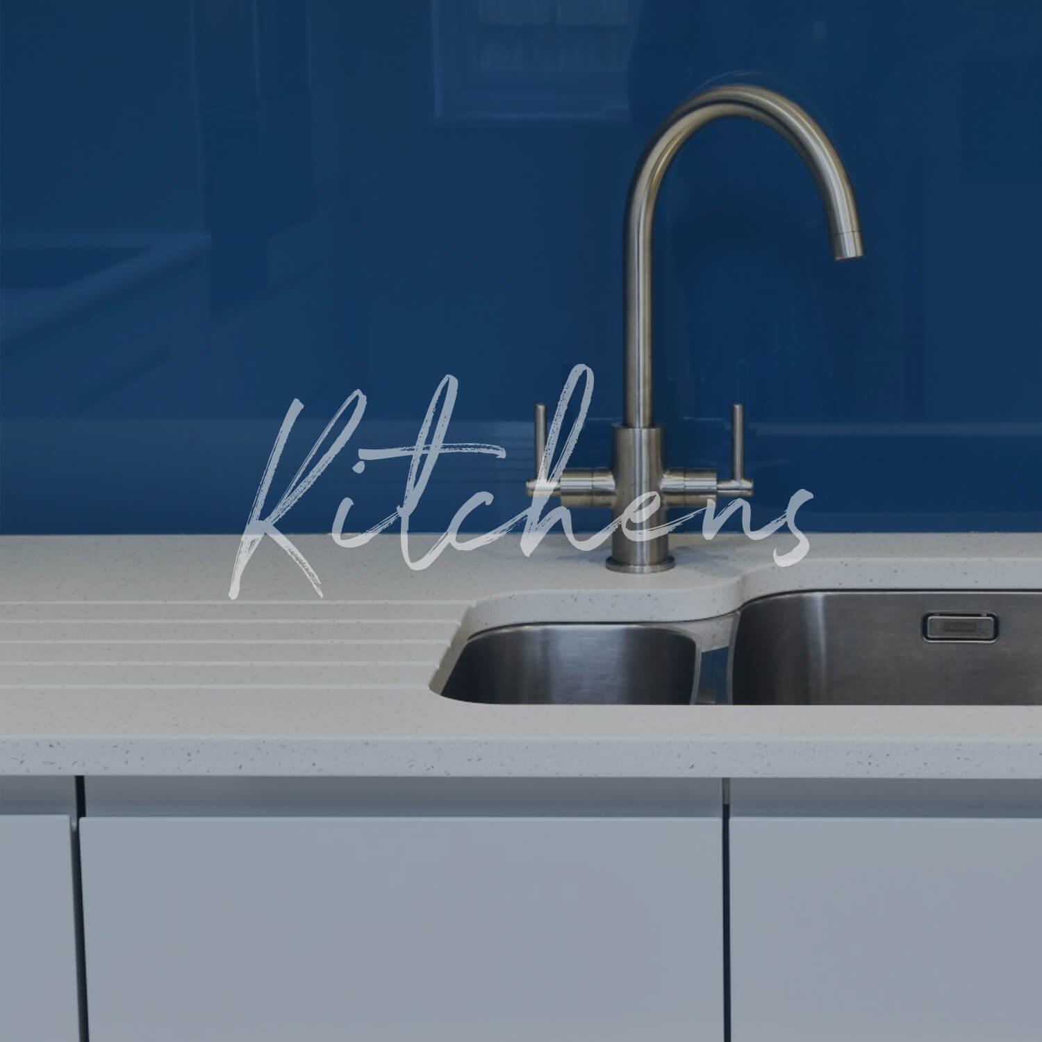 Image of kitchen interior with a sink and blue wall representing kitchen design and build services in Bury St Edmunds, Suffolk.