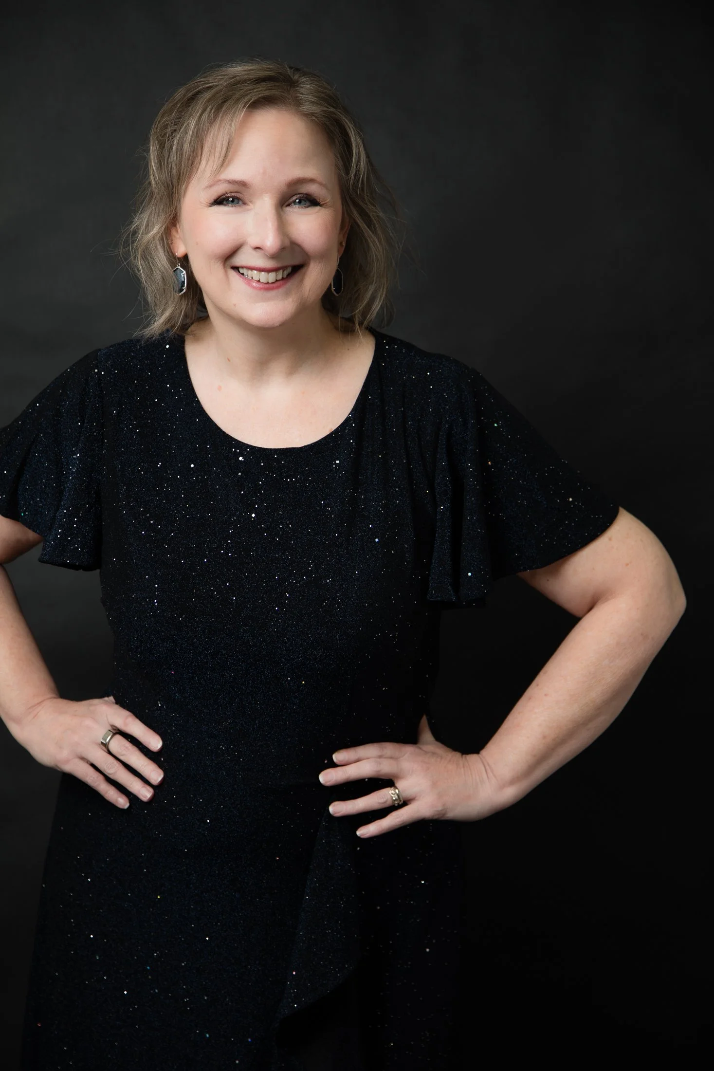 Close-up portrait of Laurie in a classic black dress, celebrating the confidence and beauty of women over 50.