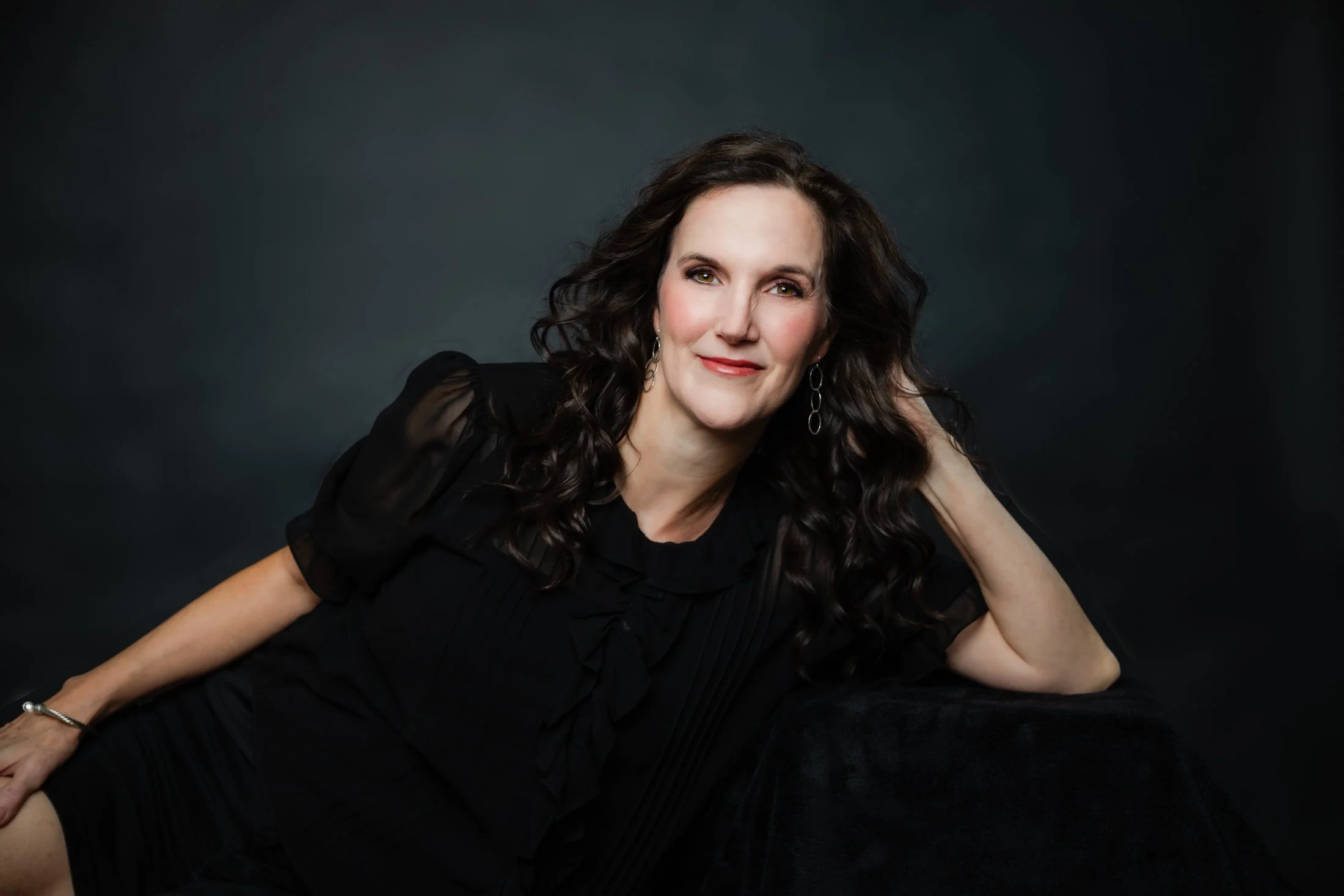 Elegant portrait of Laura in a black dress from the Wise Women 50 Over 50 Portrait Experience in Houston by Amanda Faucett