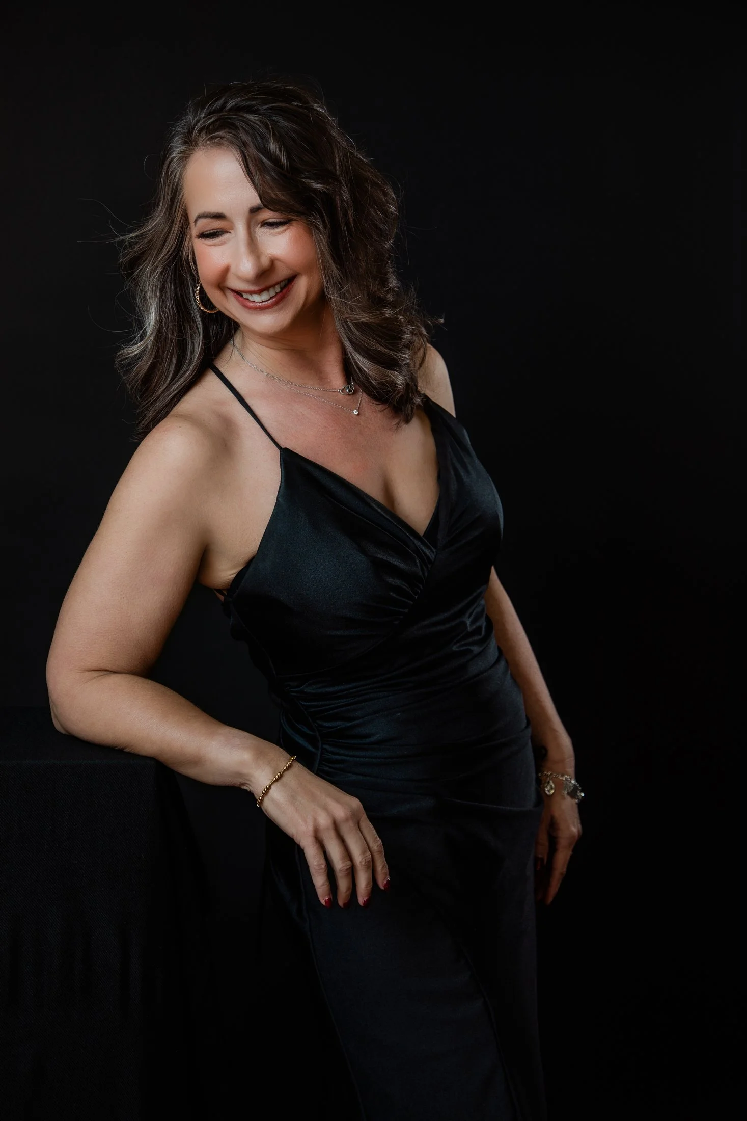 A portrait highlighting the hard work and dedication paid off for Michele to help her meet fitness goals, created during Amanda Faucett's 50 Over 50 portrait campaign.