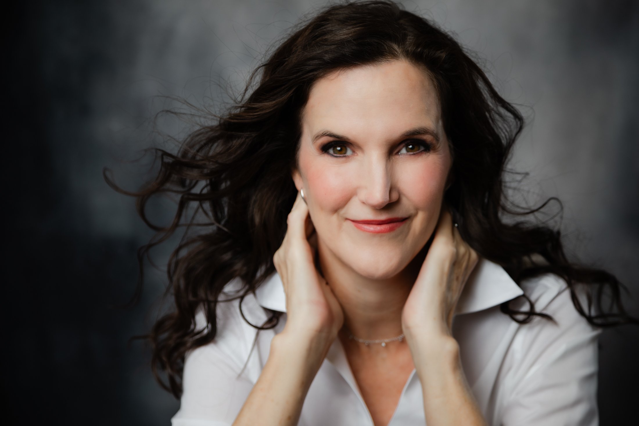 Timeless studio portrait of Laura, celebrating beauty and confidence after 50.