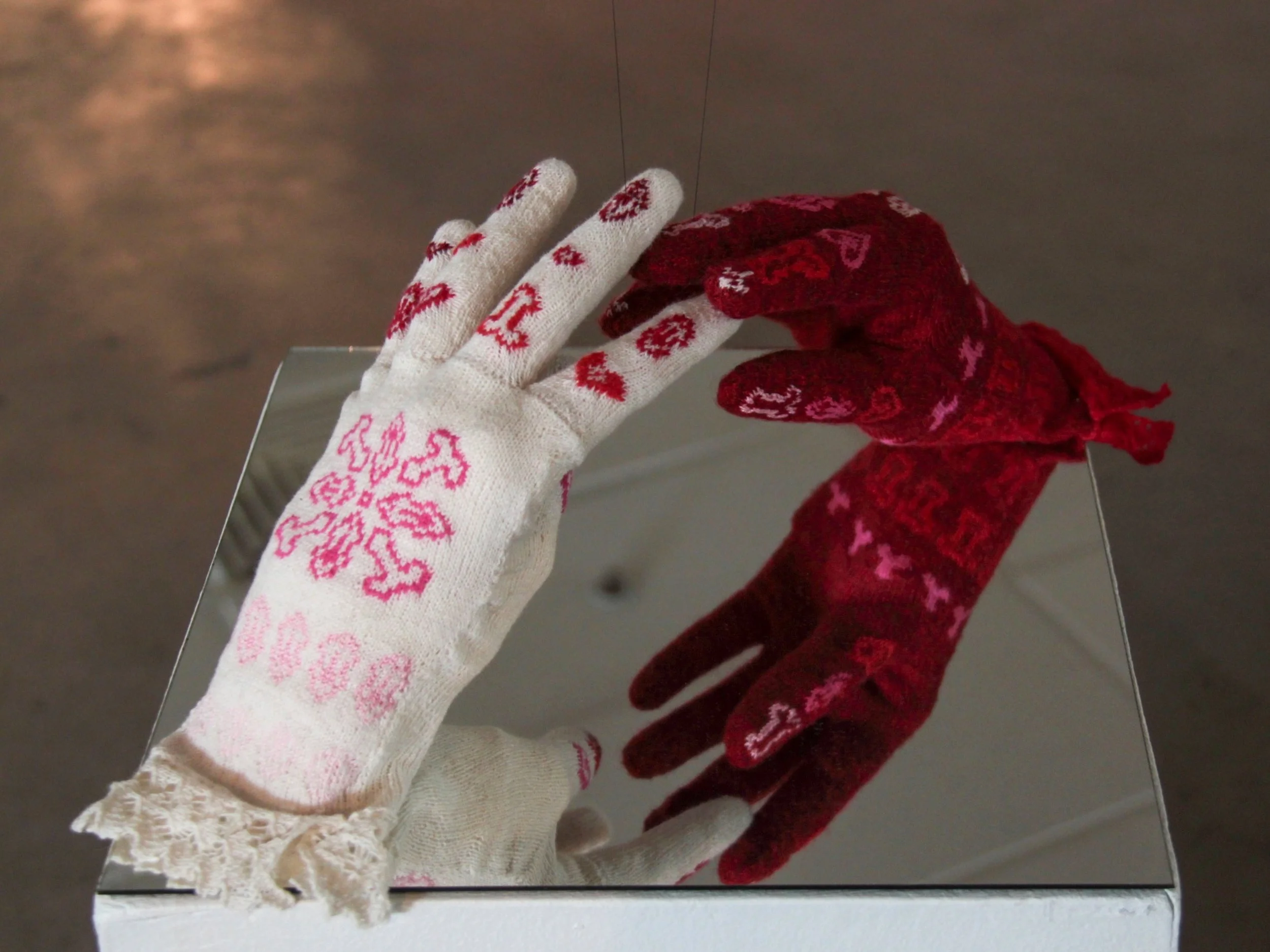 ‘Glove Love’, 2013 . Plaster, hand knitted wool and lace.