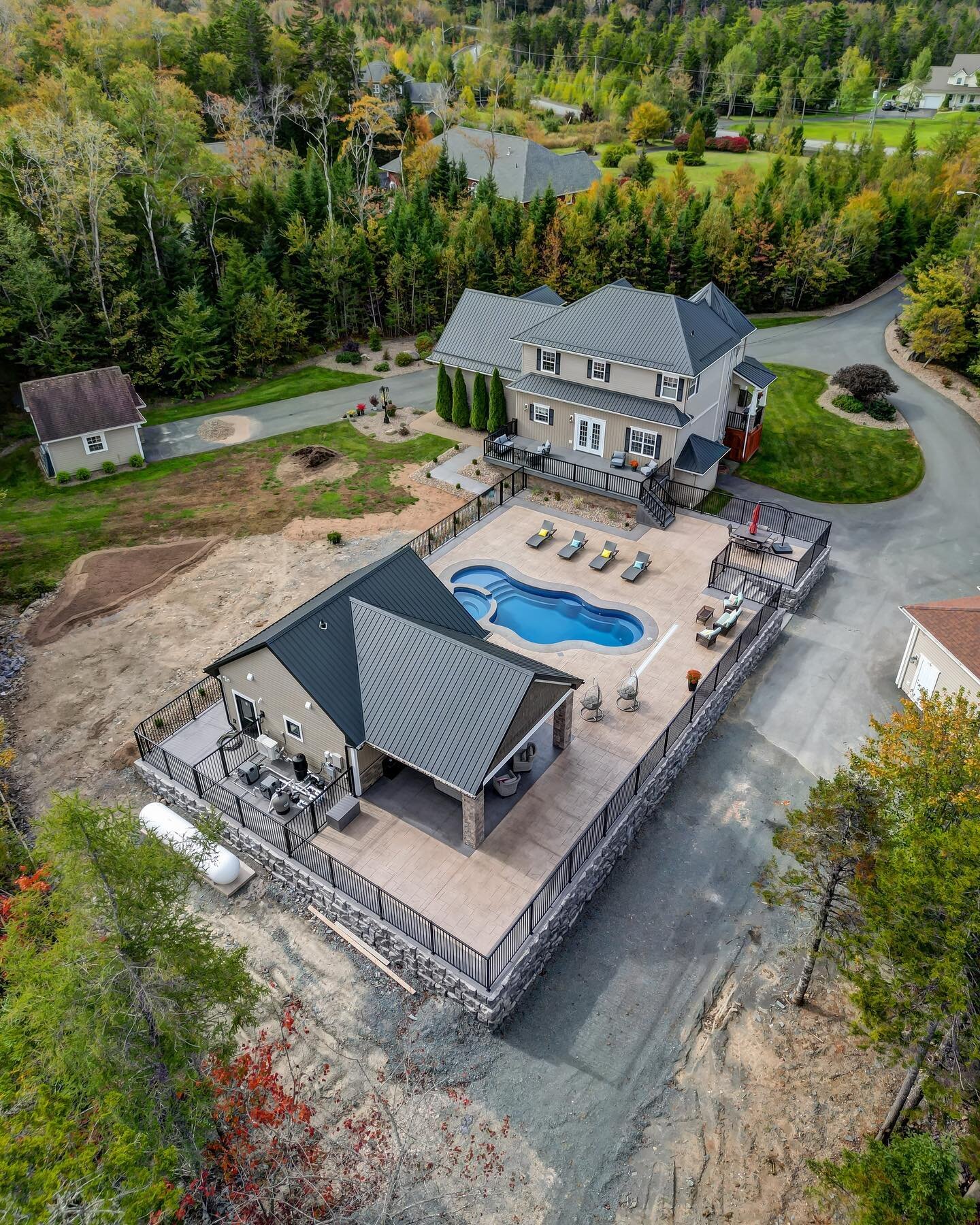 Beautiful photos of a project we had the pleasure of working on for our friends at @highmarkcustomhomes  We installed the stone retaining wall and the @regalideas 5&rsquo; pool fence. 
What a stunning outdoor living space! 
#retainingwall #dreambacky