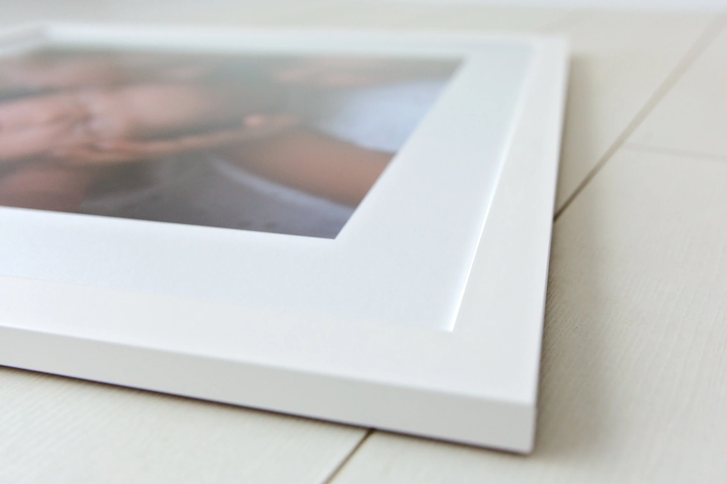 White framed family photo print by Three Wishes Photography
