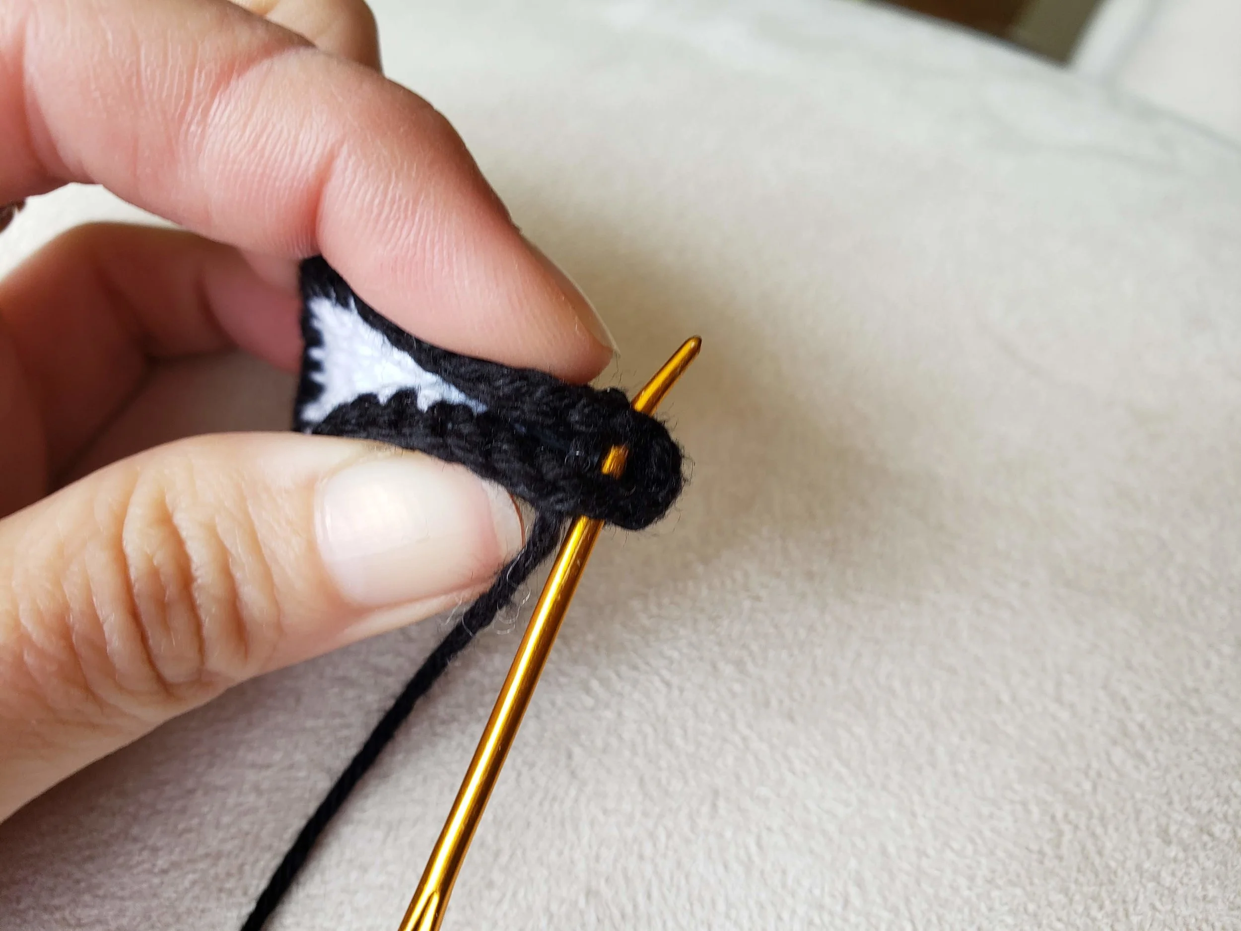Secure the pinch by sewing the pinched end together