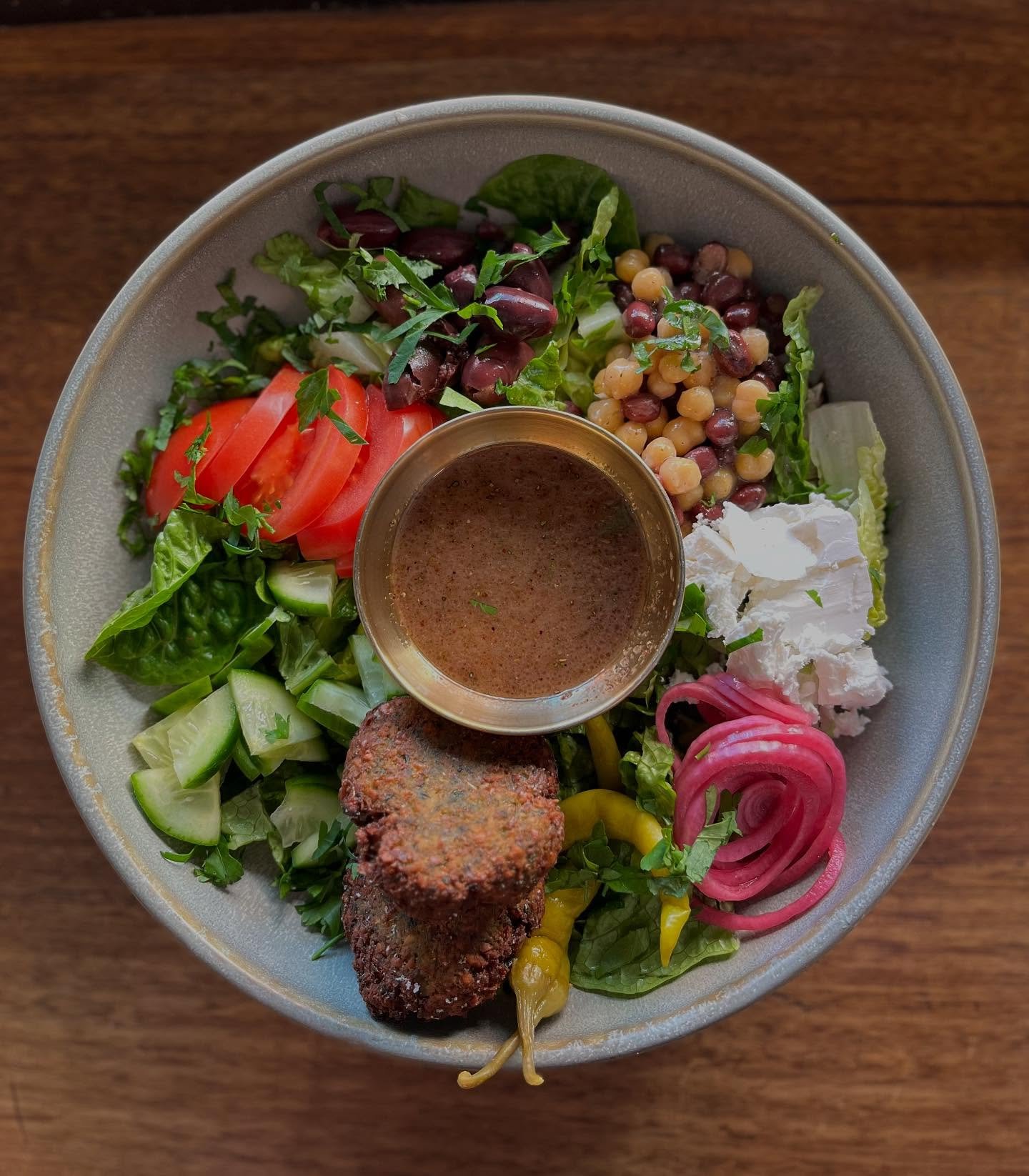 Mediterranean salad - chickpeas, adzuki beans, olives, cucumber, tomato, organic lettuce, fetta, green herb felafels, guindilla pickles, sumac + oregano dressing… you can add on things like grilled free range chicken, grilled haloumi, house cu