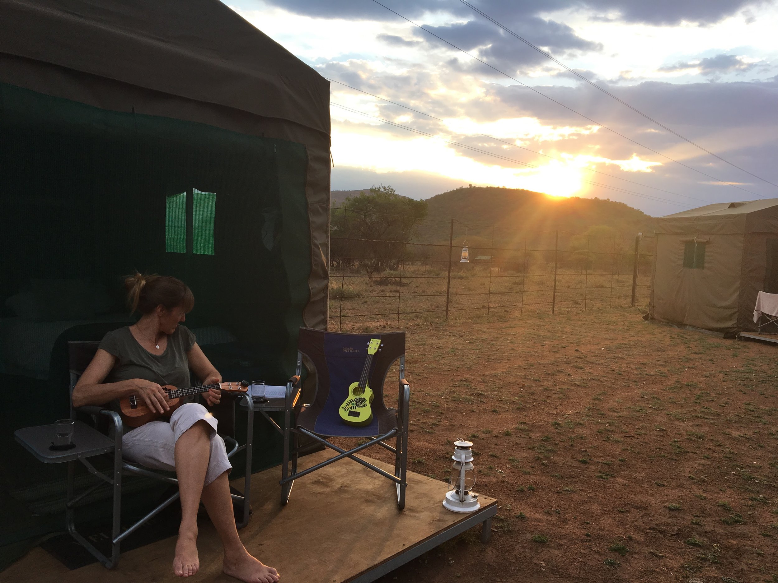 ukulele at sunset at the tented camp outside the park.JPG