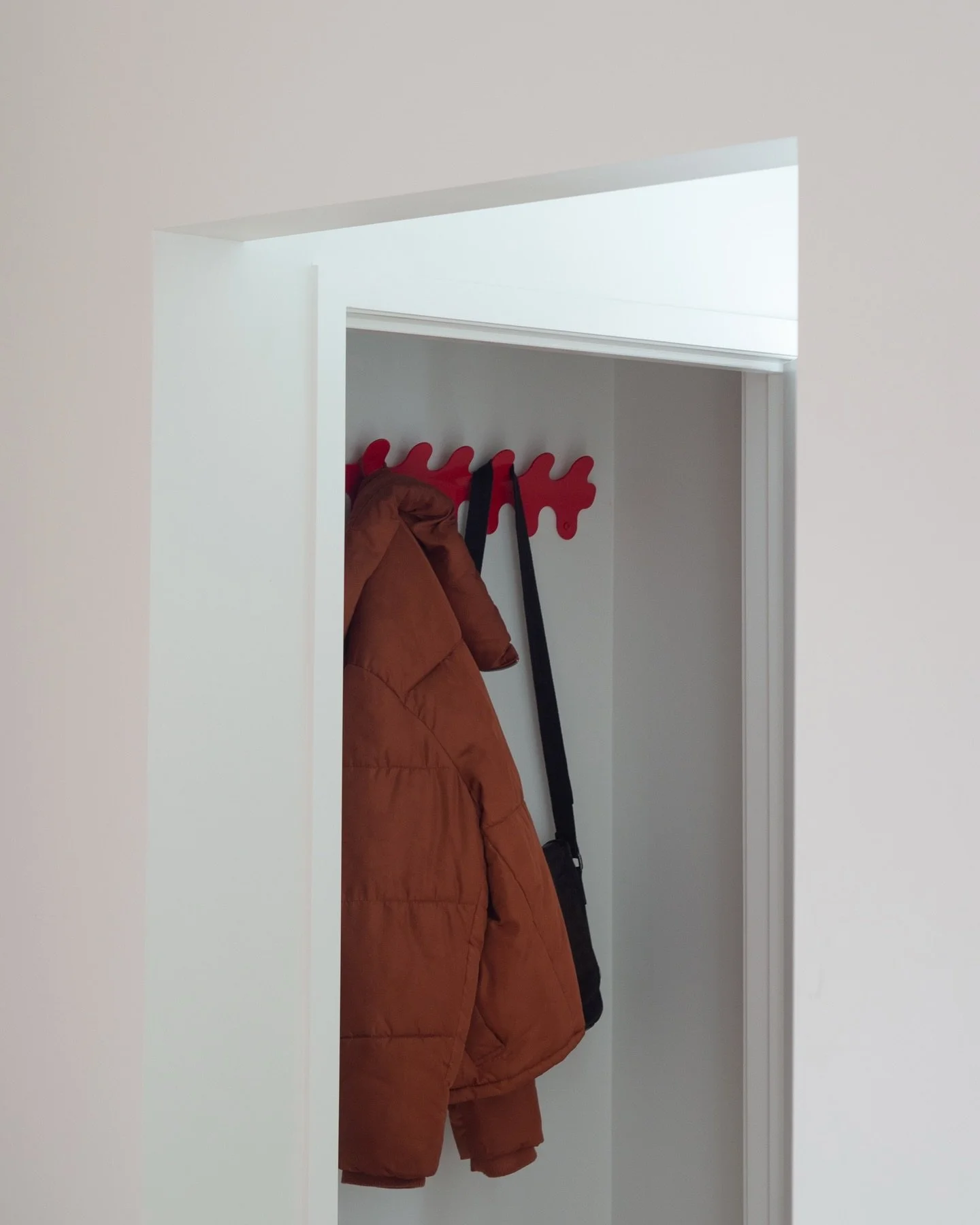 The Wiggle Wall Hanger holding it up and away 👌

Finish: Gloss Cola Red.
Manufactured in New Zealand.

Easter Treat - take $10 off any order this long weekend. Automatically applied at checkout. Ends Monday 11:59pm NZT.

#oddthing #madeinnewzealand