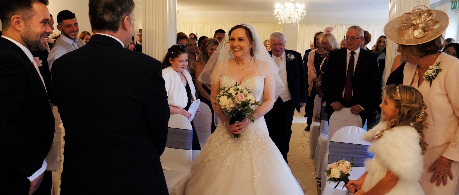 Walking the aisle at quendon hall essex.jpg