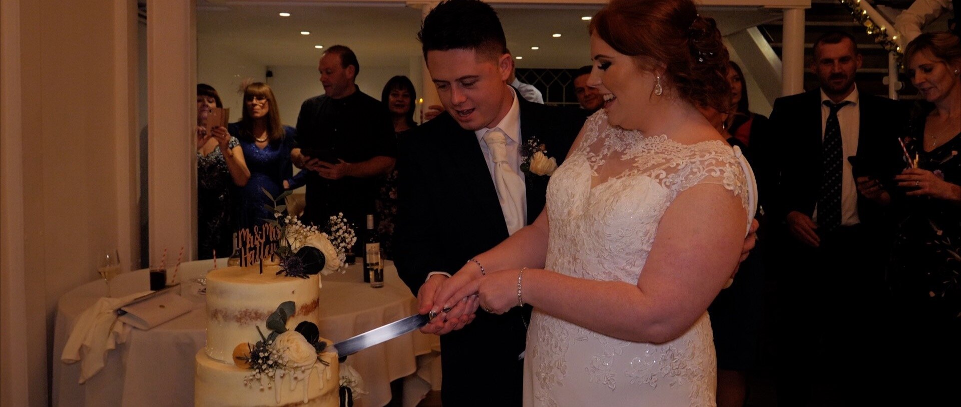cutting the wedding cake essex videography.jpg