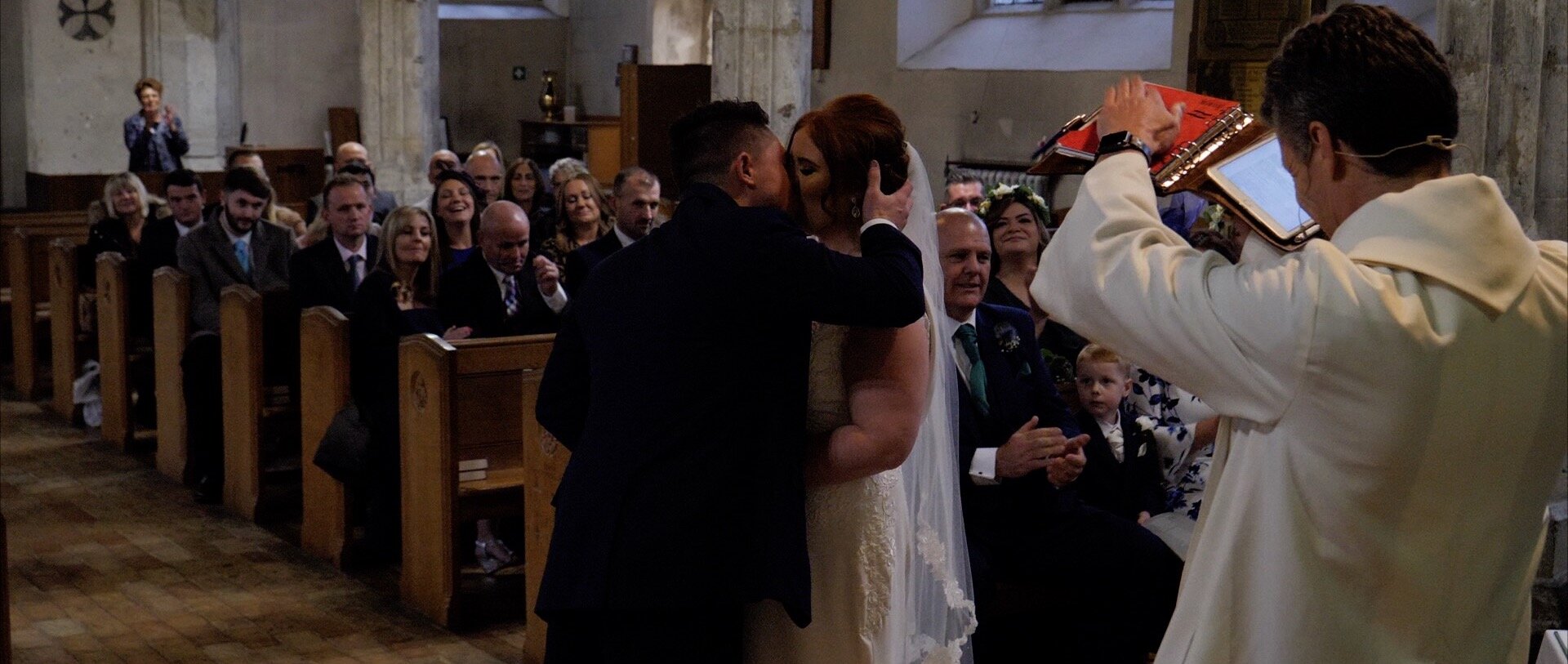 Wedding Kiss Holy Trinity Church Rayleigh Essex.jpg