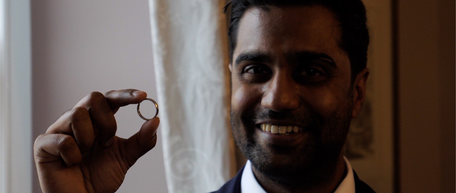 Inidan groom holding a wedding ring video.jpg